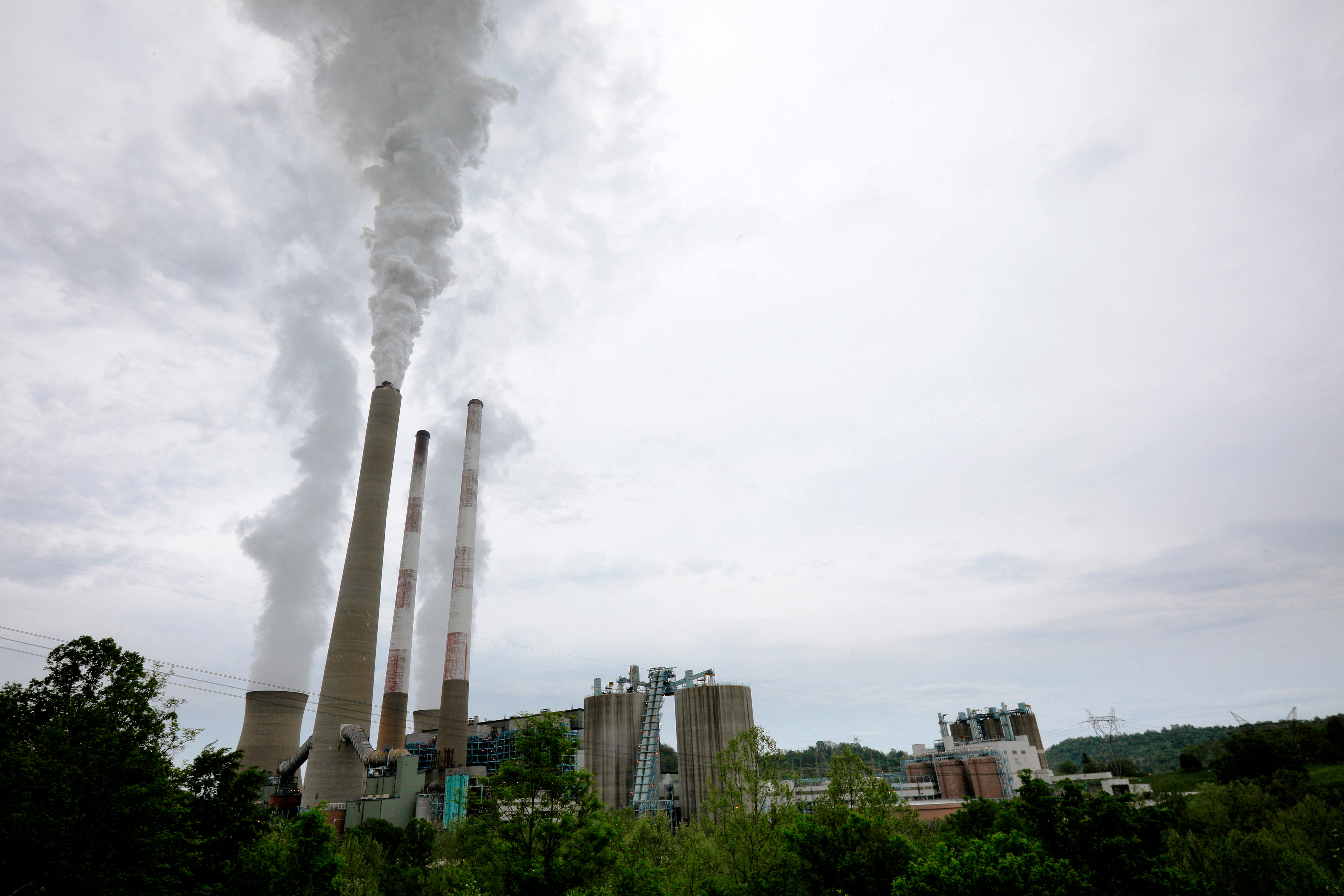 Exhaust rises from the stacks of the Harrison Power Station in Haywood, West Virginia, May 16, 2018.