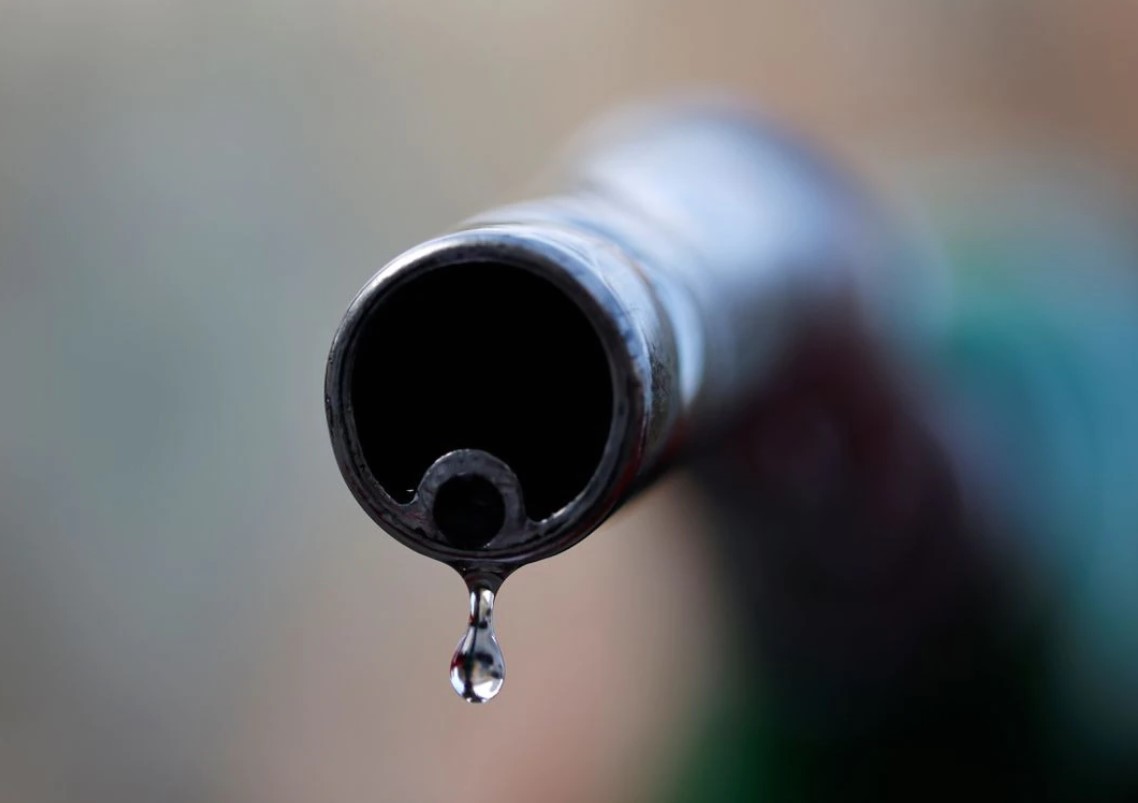 A drop of diesel is seen at the tip of a nozzle in a petrol station in Nice, France, Oct. 20, 2021.