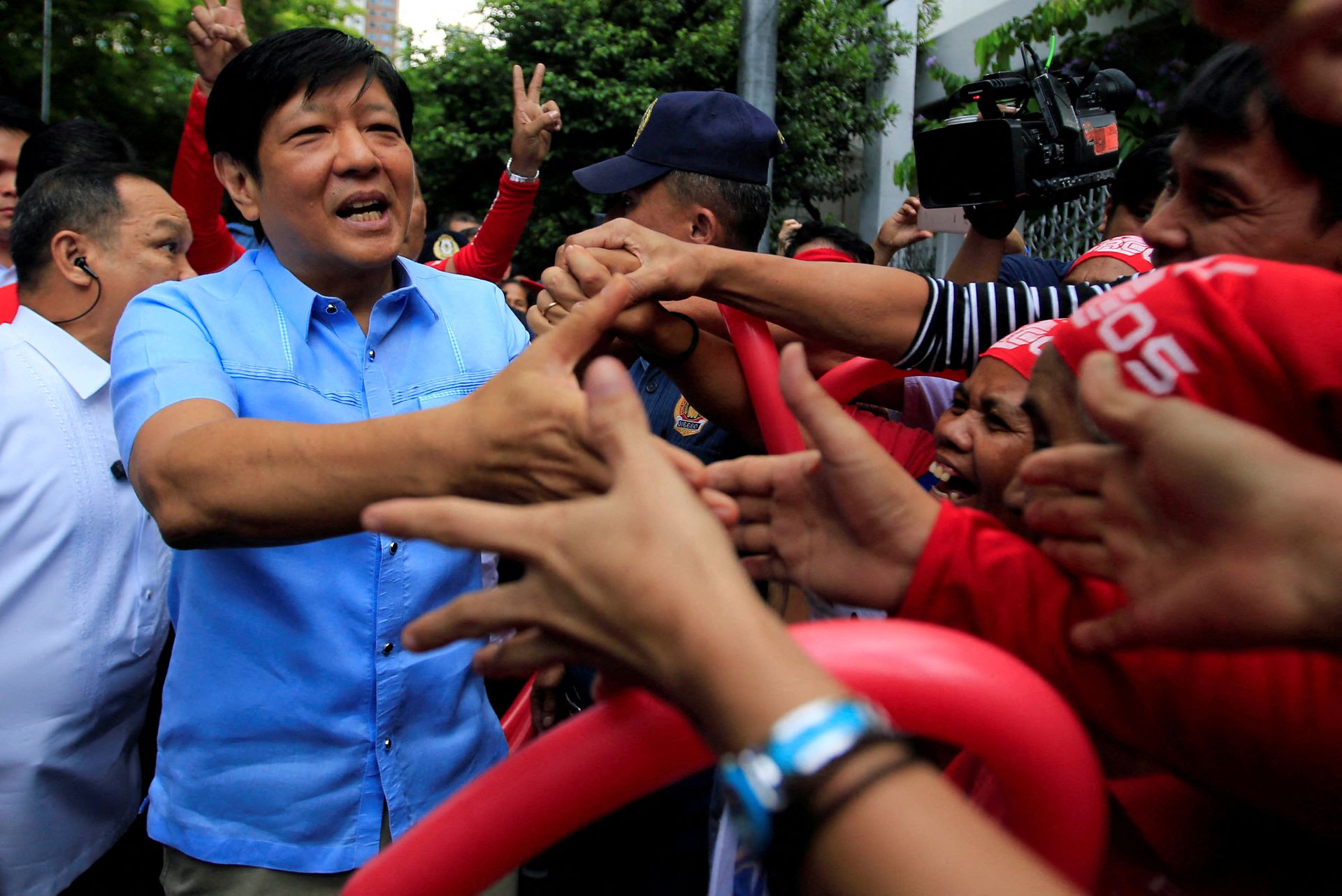 Former Sen.  Ferdinand "Bongbong" Marcos Jr. is greeted by his supporters upon his arrival at the Supreme Court in Manila, the Philippines on April 17, 2017.