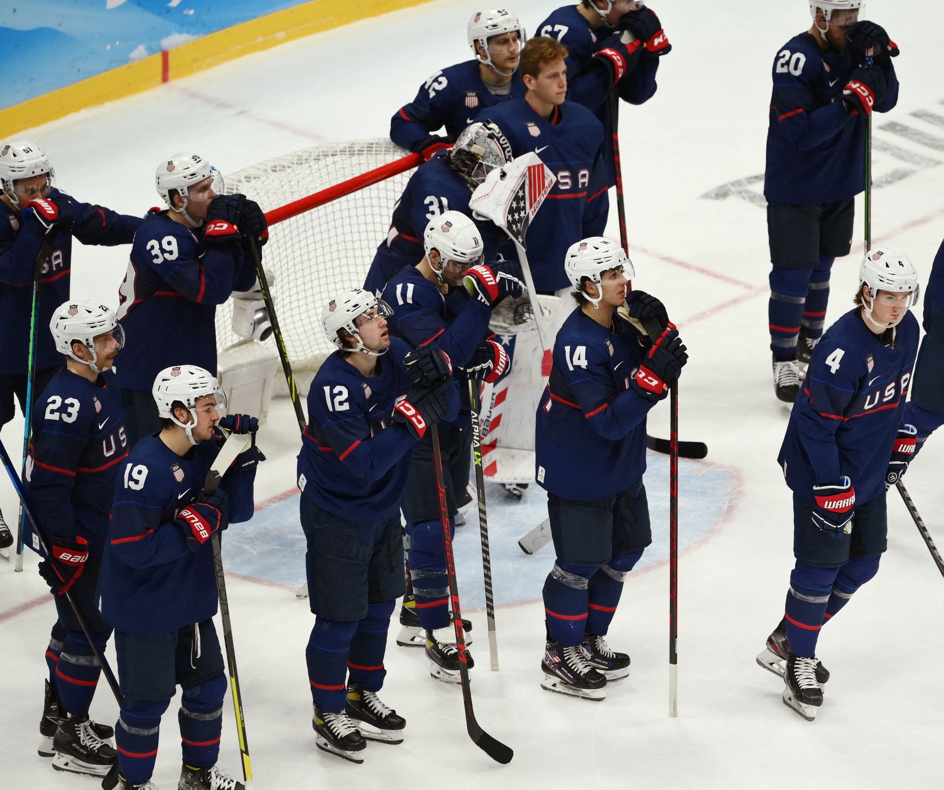 The U.S. players look dejected after losing the match against Slovakia at the National Indoor Stadium in Beijing, China on Feb. 16, 2022.