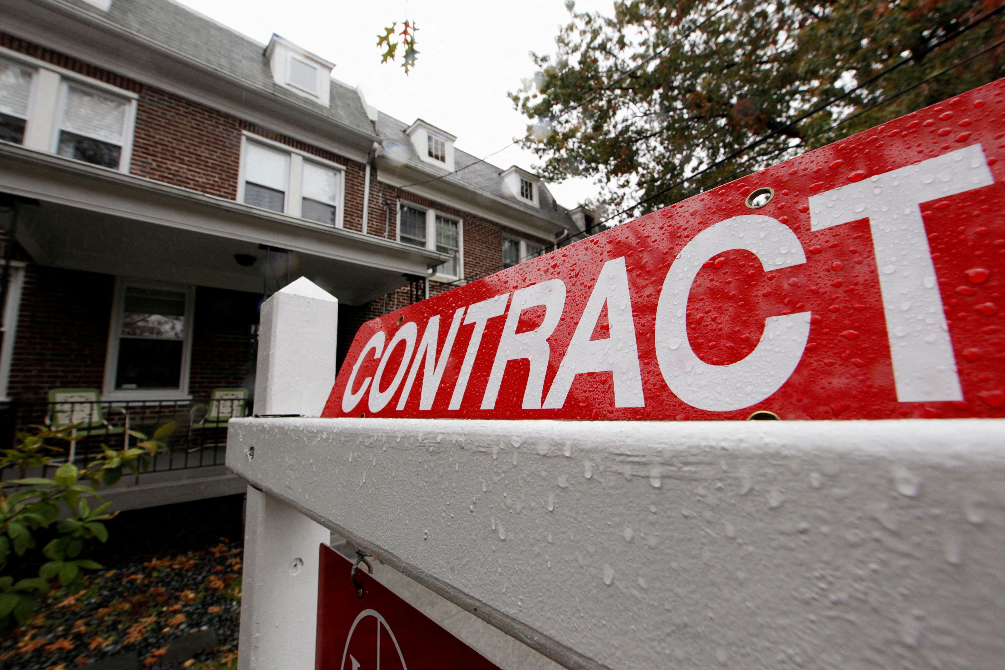 A home with a sign indicating that it is under contract to be sold is seen in a neighborhood of downtown Washington, Oct. 27, 2009.