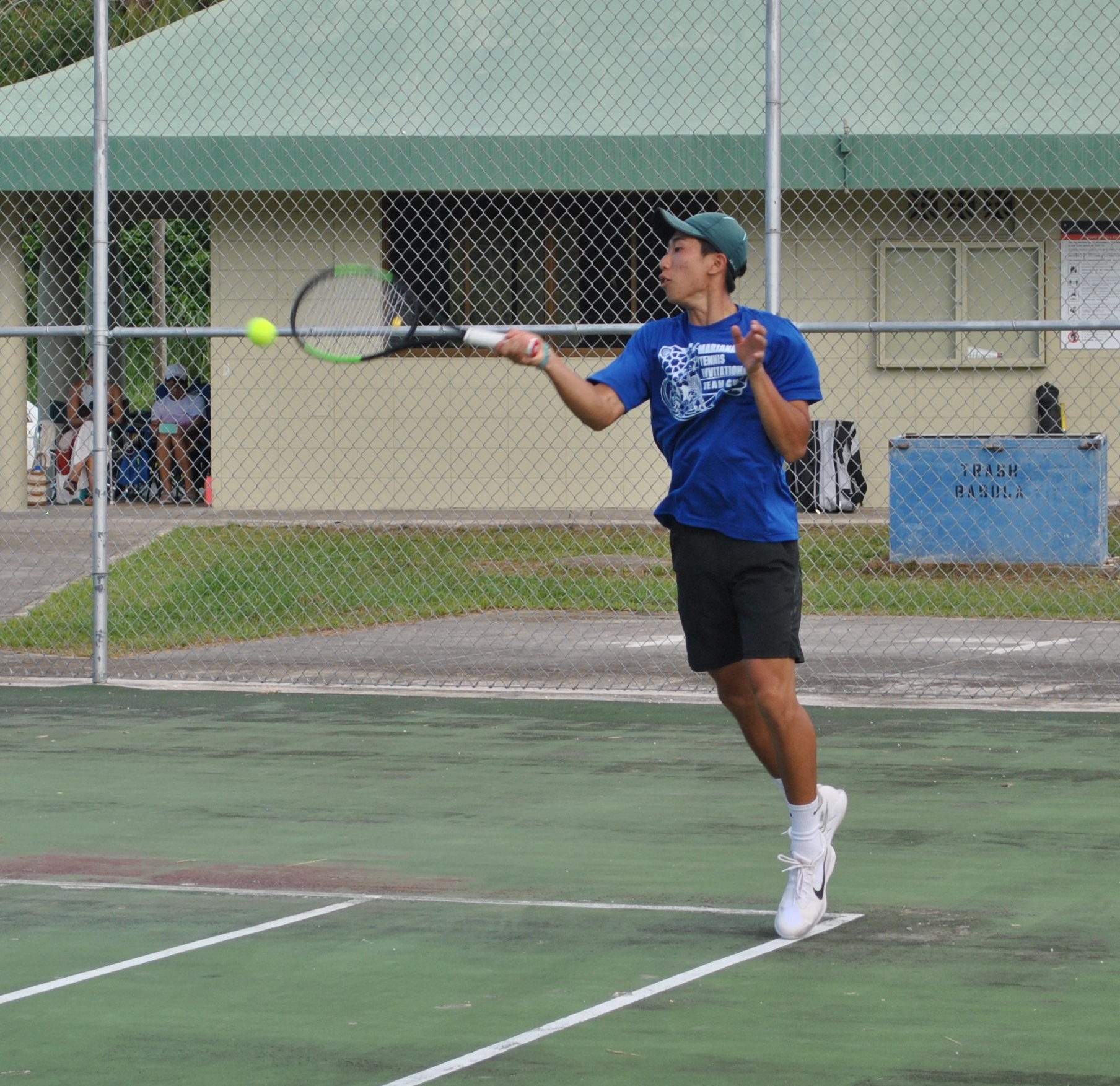 Jimin Woo extends for the return during a tennis match at American Memorial Park.