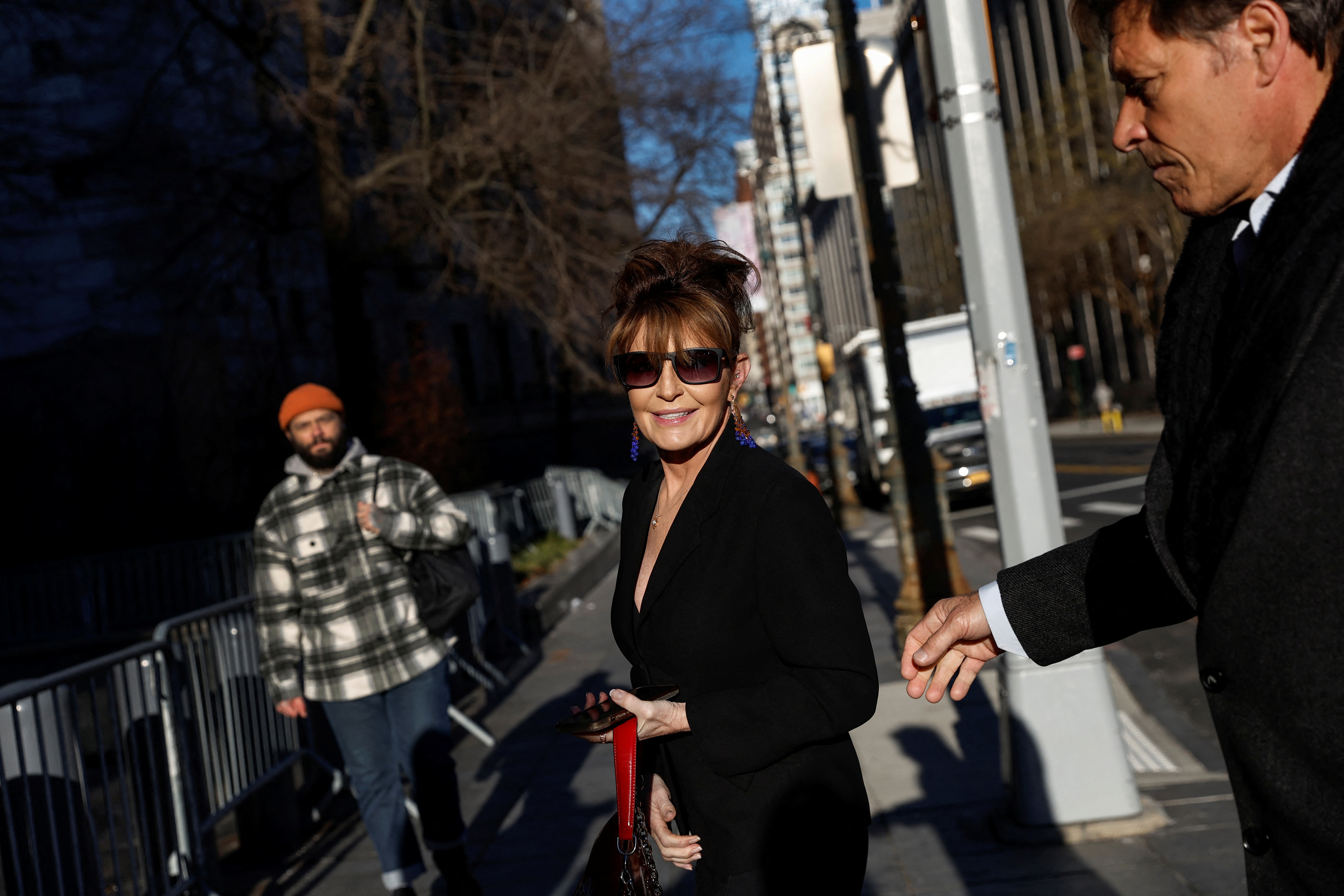 Sarah Palin, 2008 Republican vice presidential candidate and former Alaska governor, arrives with former NHL hockey player Ron Duguay during her defamation lawsuit against the New York Times, at the United States Courthouse in the Manhattan borough of New York City, Feb. 11, 2022.