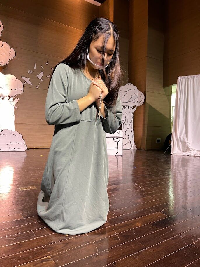 Maria, played by Bernice Sabino, calls on the Lord for guidance as she faces challenges.