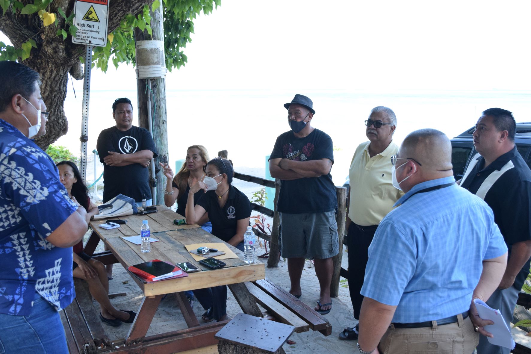 Keith Ada, third left, listens as Infrastructure and Recovery Program civil engineer Mariano Iglesias, second right, briefs officers of Bantalan Sugar Dock Inc. and Gov. Ralph DLG Torres, right, about the pavilion project on Thursday at Sugar Dock in Chalan Kanoa.