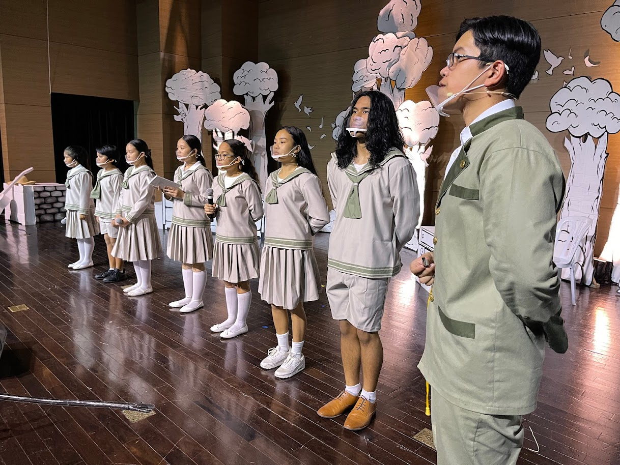 The von Trapp children are called to attention by their father, Captain George von Trapp, played by Manuel Pangelinan.
