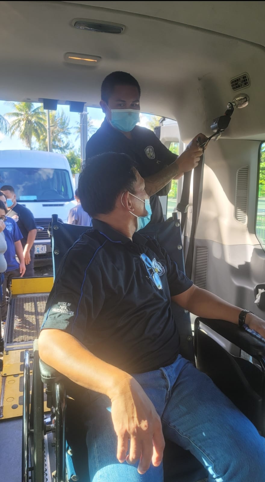 Patrick Ogo of Rota carefully uses the wheelchair lift to perform the hands-on testing for the PASS certification.