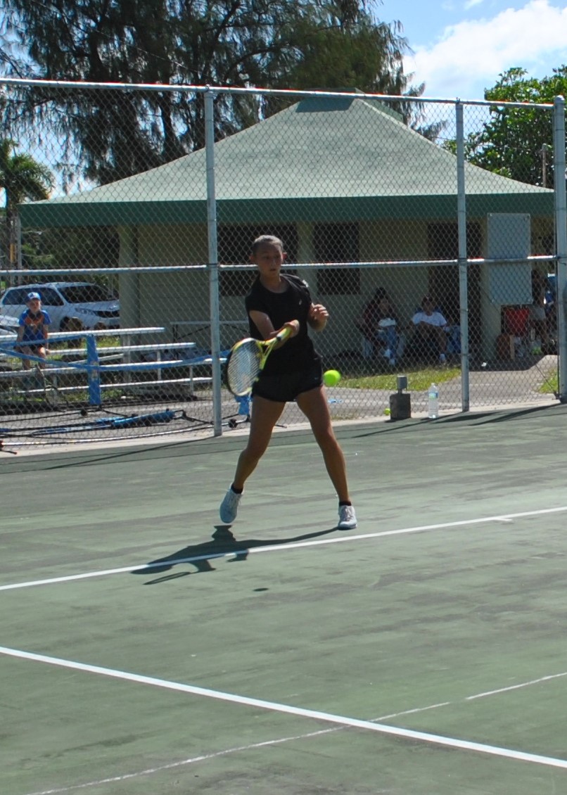 Hyejin Elliot connects the return during a tennis match at American Memorial Park.