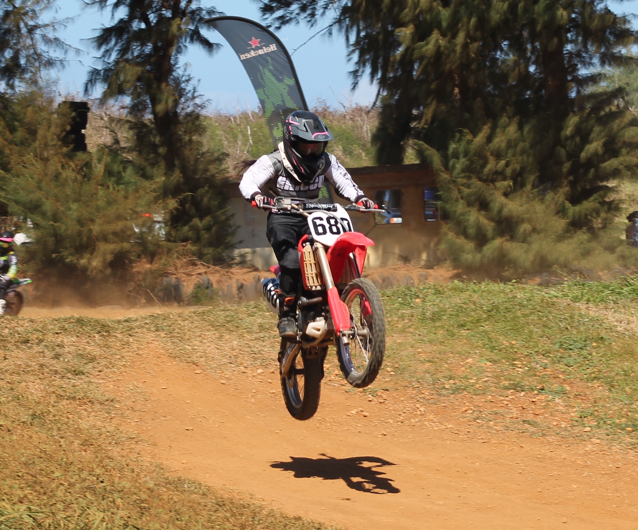 Billie Pangelinan makes the jump during the Power Puff Girls race Sunday at  Cow Town Raceway Park