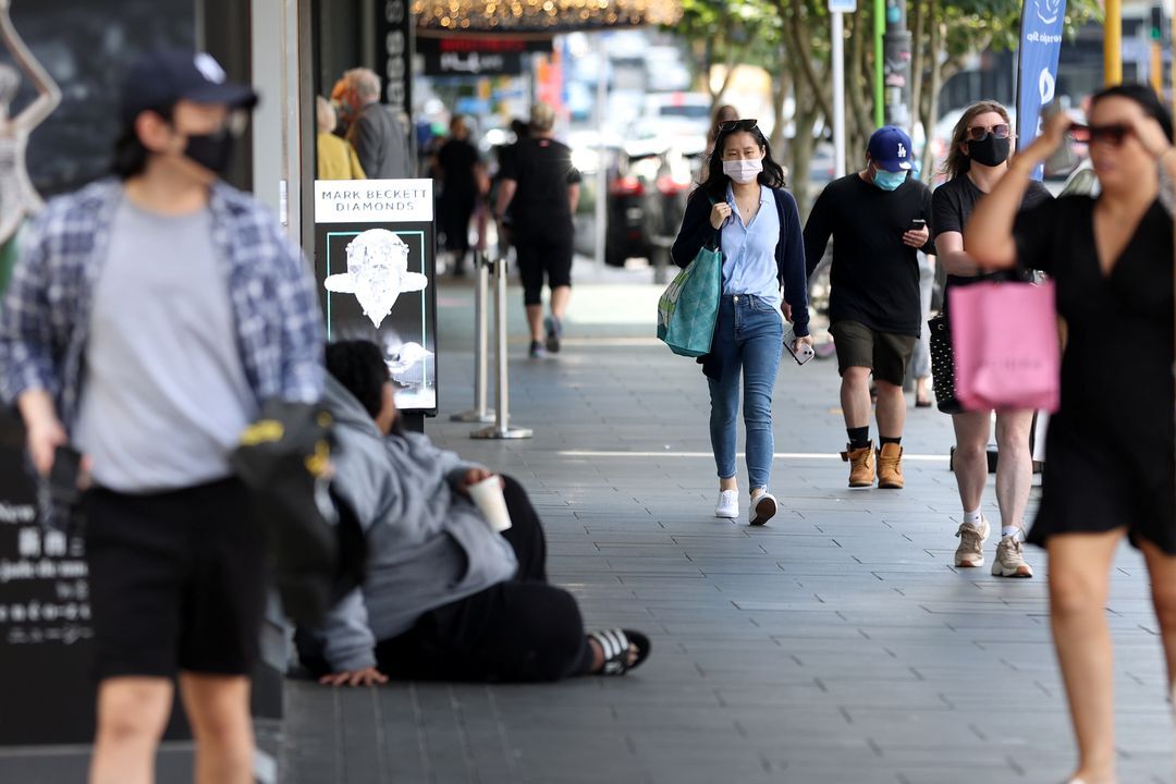Shoppers walk through a retail district in the wake of coronavirus disease lockdown restrictions being eased in Auckland, New Zealand, Nov. 10, 2021. 