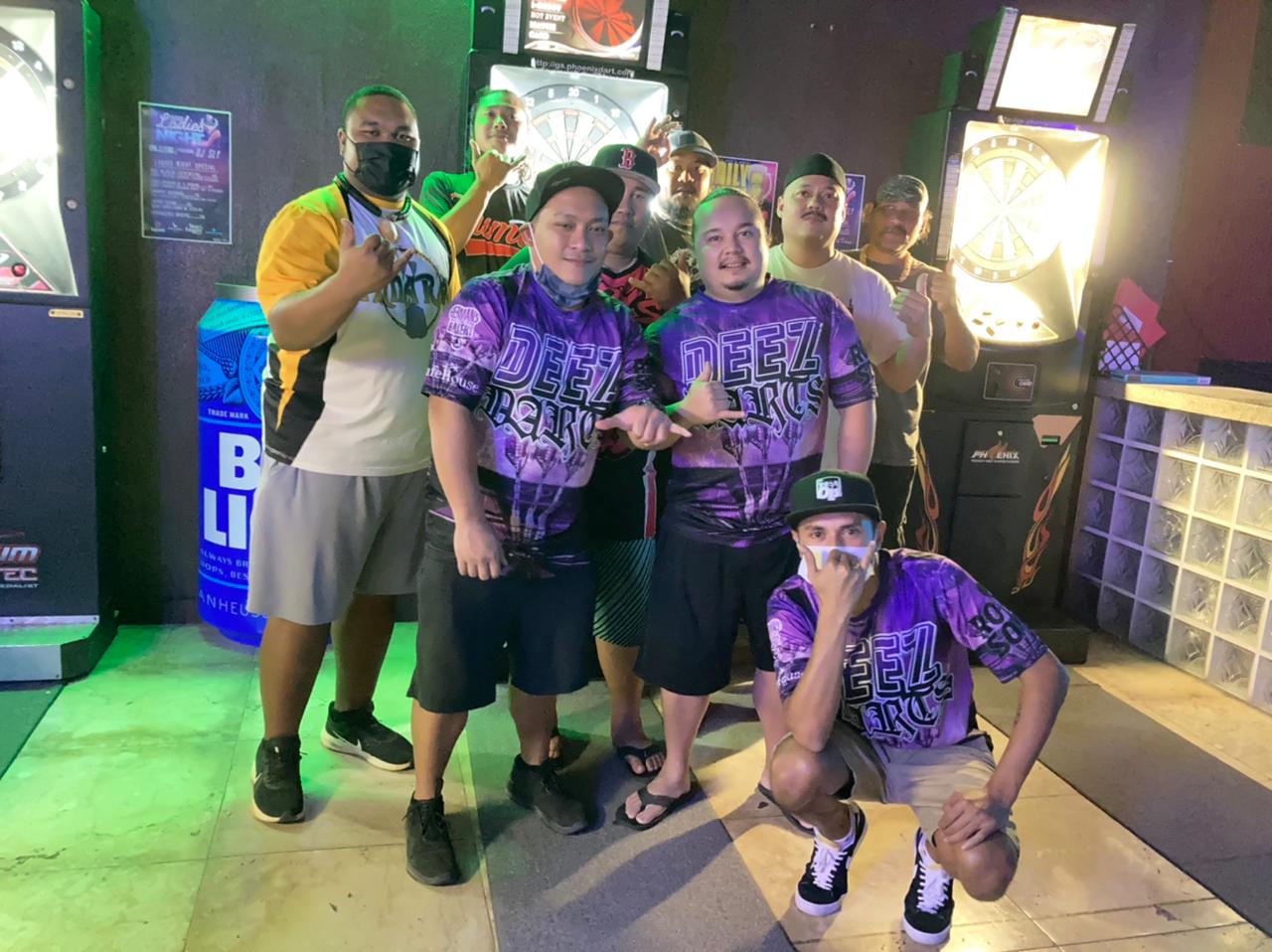 Safehouse Deez Darts team members pose for a photo after winning their match in the C Division of the SEDA Bud Light League Wednesday at Jonny's Bar.