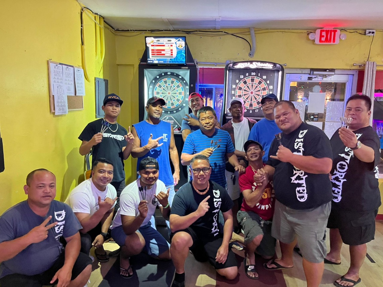 The Tambayan Distorted B team members and the Tambayan 80 Proofers pose for a photo after a Thursday B Fanihi Division match of the SEDA Bud Light League at the Tambayan Bistro Bar on Thursday.