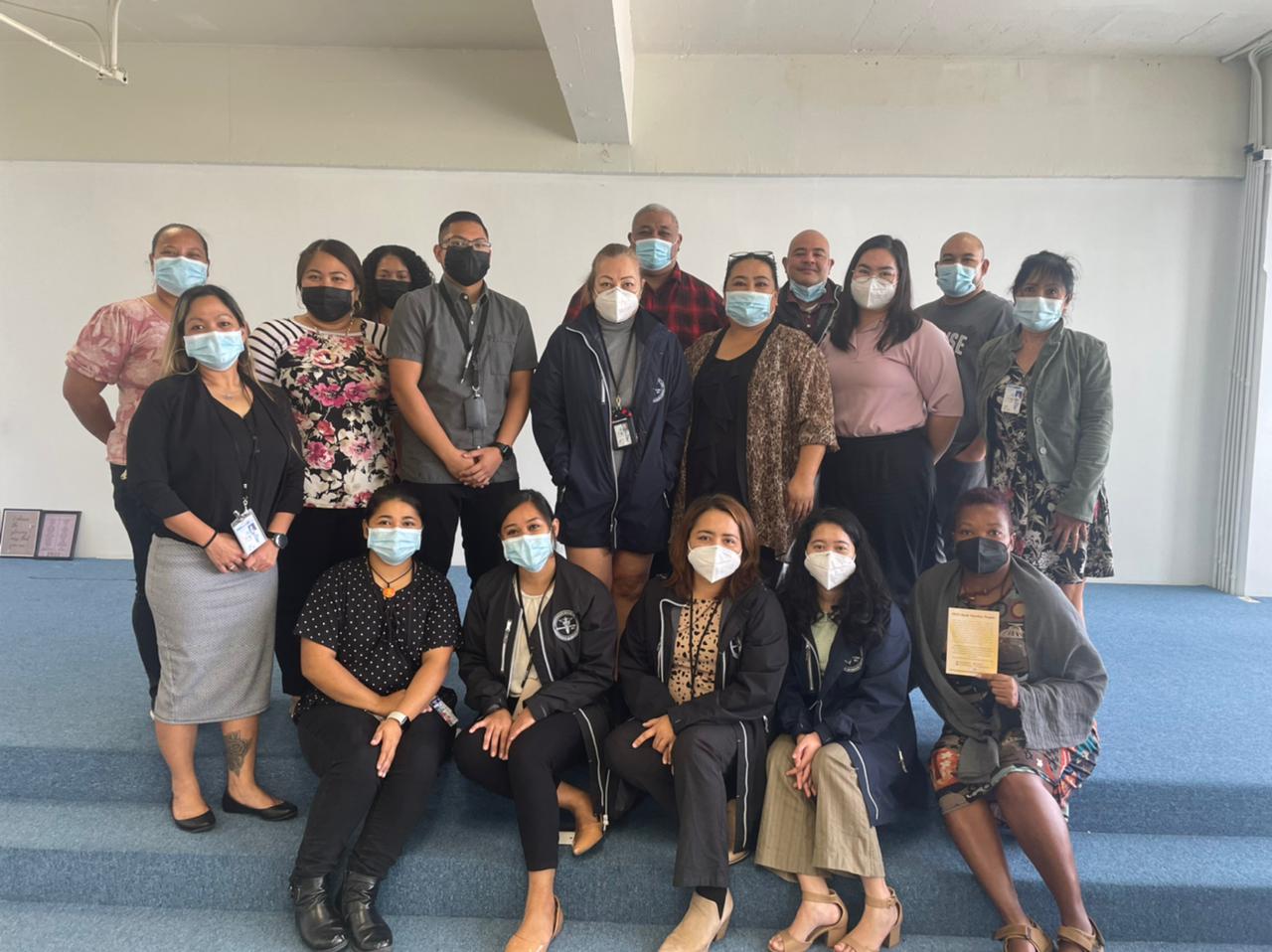 CHCC CGC Crisis Counseling Program and Behavioral Health Response Program staff members pose with QPR trainer Fred Fatialofa, back row, center, after completing a 90-minute Question, Persuade, and Refer training session.