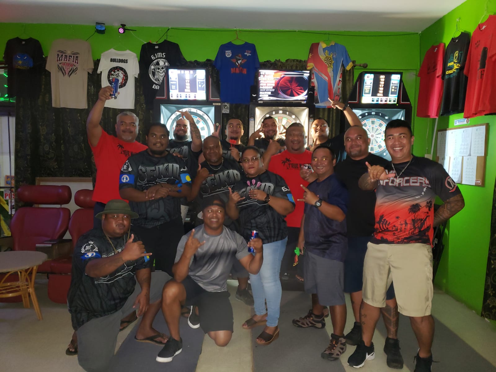 The players of True North Vipers and 6JMS Seikid B pose for a photo during a Flame Tree Thursday B Division match of the SEDA Bud Light League at the 6JMS Sports Bar.