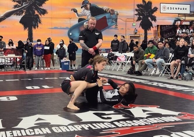 Marilyn Cruz smiles during a match in the Women's No-Gi Expert Division (strawweight) of the North American Grappling Association  on Jan. 29 in San Marcos, California.