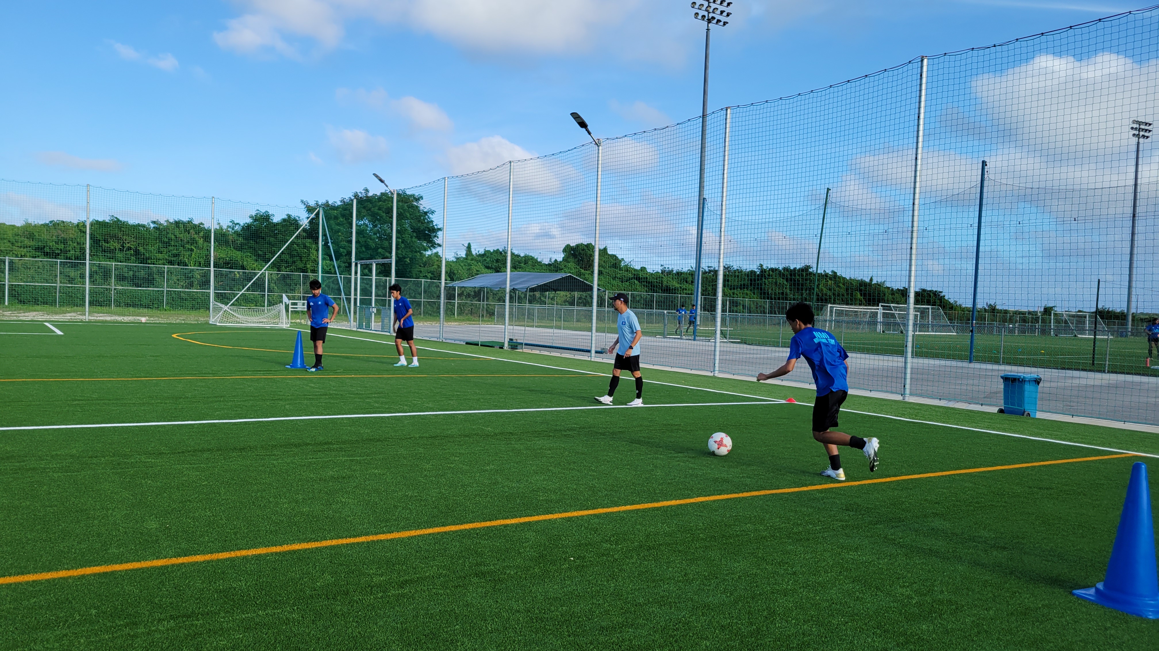 The Men's/U19 NMI National Team members participate in a training session at the NMI Soccer Training Center last month.