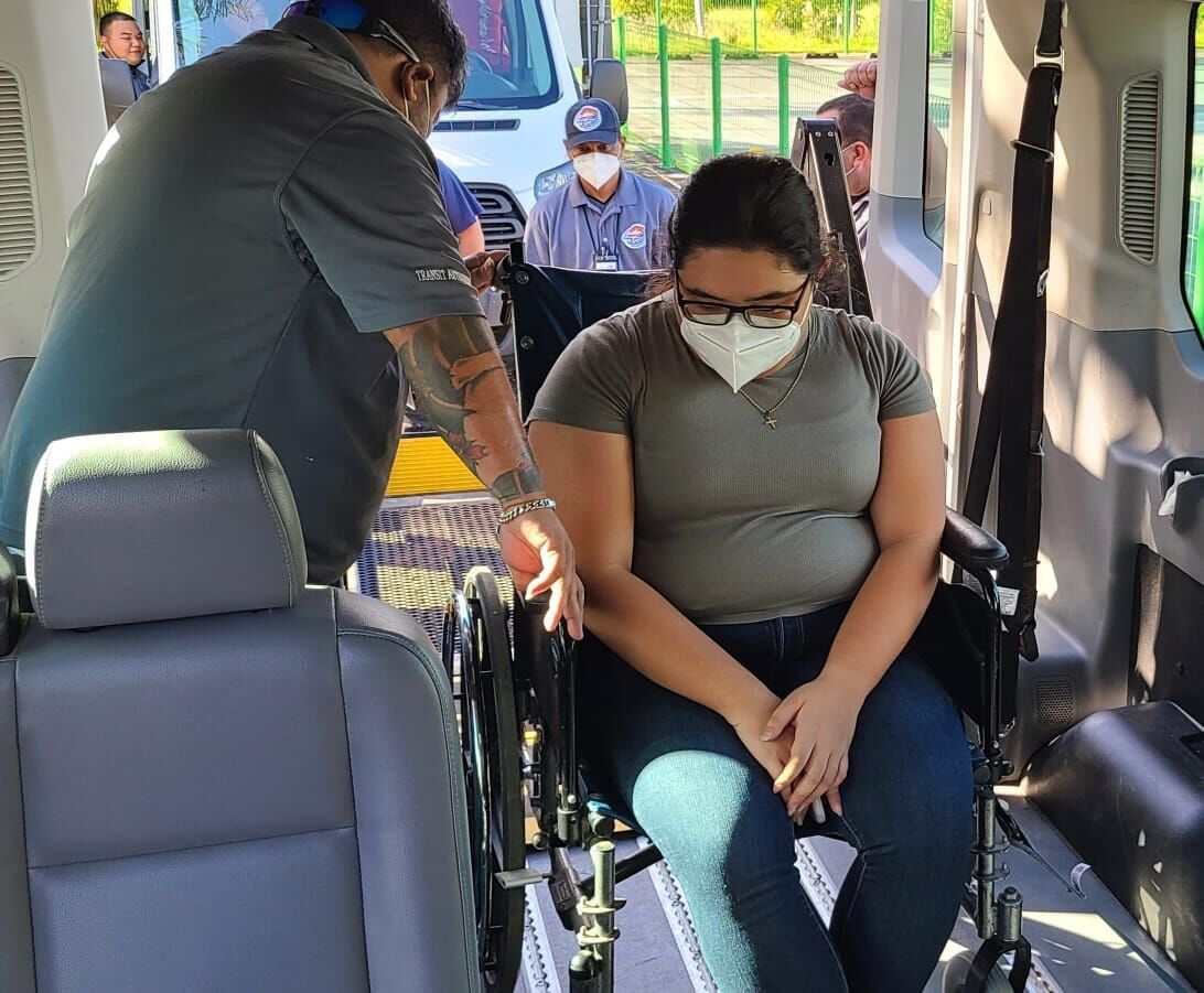 PSS Office of Pupil Transportation’s Jesus Nicdao and Nobert Ambalan go through the PASS hands-on testing for wheelchair securement.