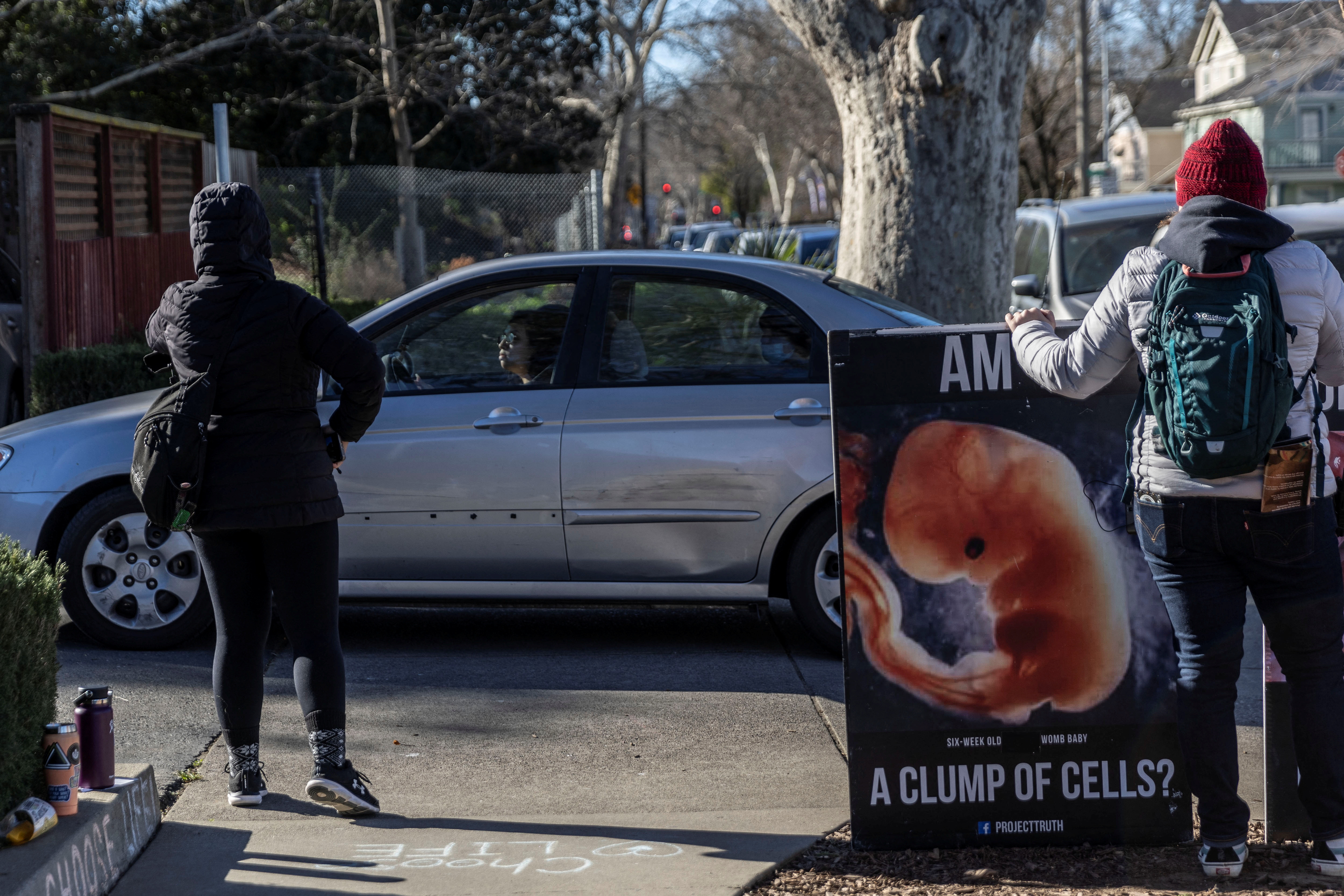 Local residents attempt to talk with a woman leaving a Planned Parenthood Health Center in Sacramento on Feb. 2, 2022  as California abortion providers are preparing for an influx of patients from other states if the U.S. Supreme Court overturns the landmark Roe vs. Wade case.