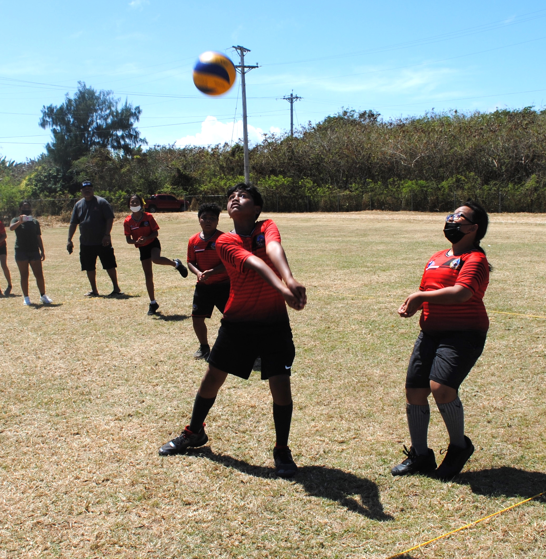 A KoES 2 player extends for the bump return during the championship game of the co-ed elementary school volleyball tournament Saturday at Chacha Oceanview Middle School field.
