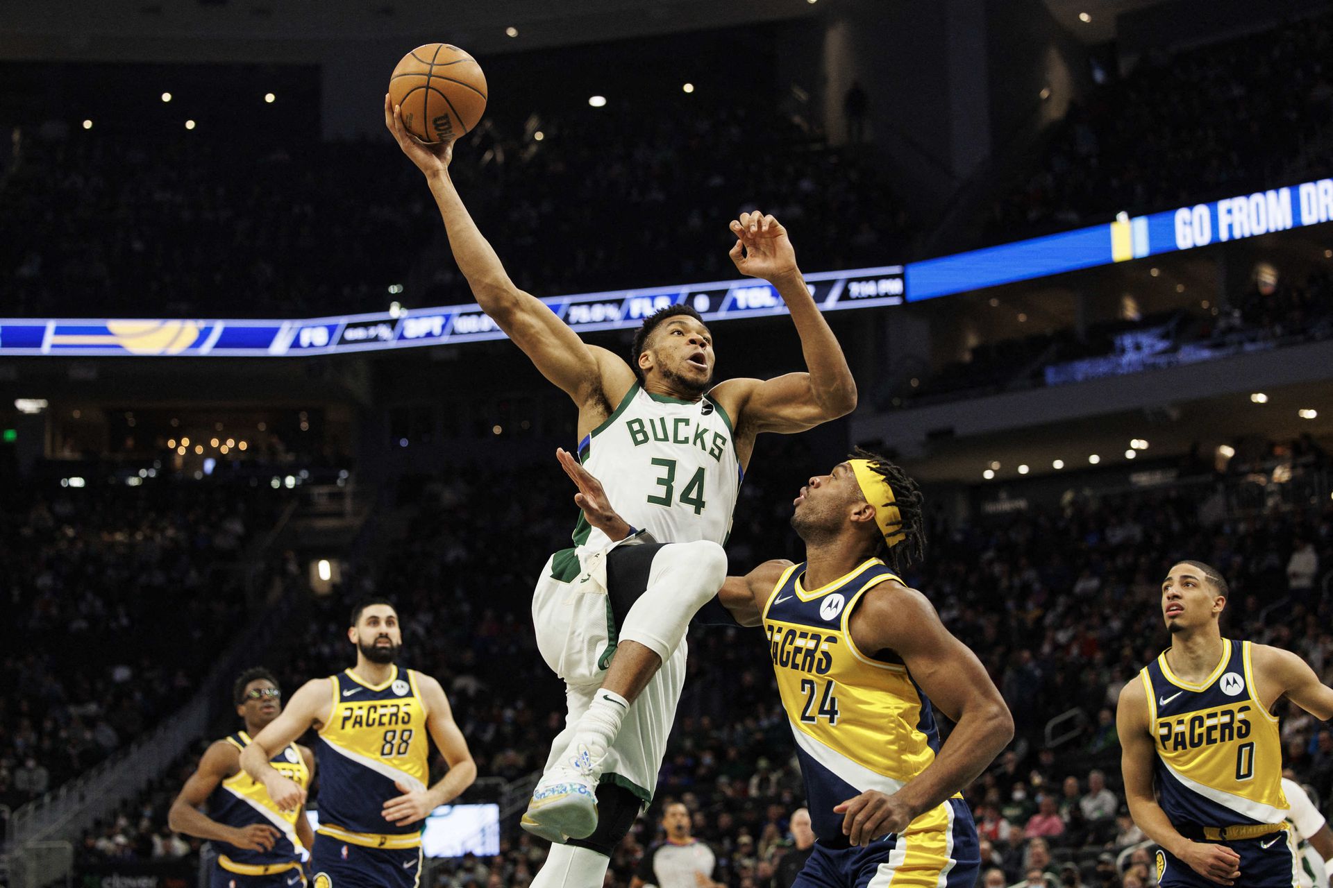 Milwaukee Bucks forward Giannis Antetokounmpo (34) drives for a dunk during the first quarter against the Indiana Pacers at Fiserv Forum in Milwaukee, Wisconsin on Feb. 15, 2022.