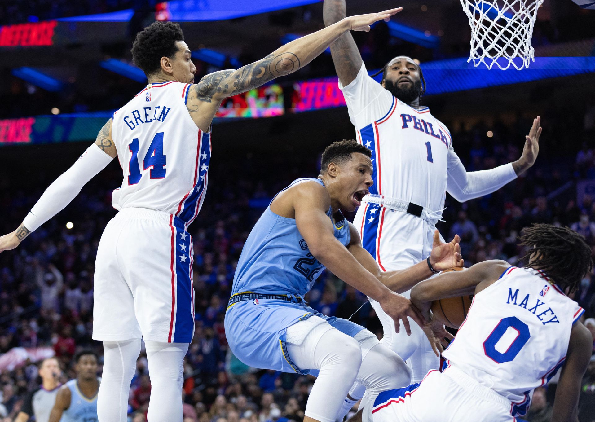 Philadelphia 76ers guard Tyrese Maxey (0) grabs a loose ball from Memphis Grizzlies guard Desmond Bane (22) during the fourth quarter at Wells Fargo Center in Philadelphia, Pennsylvania on Jan. 31, 2022.