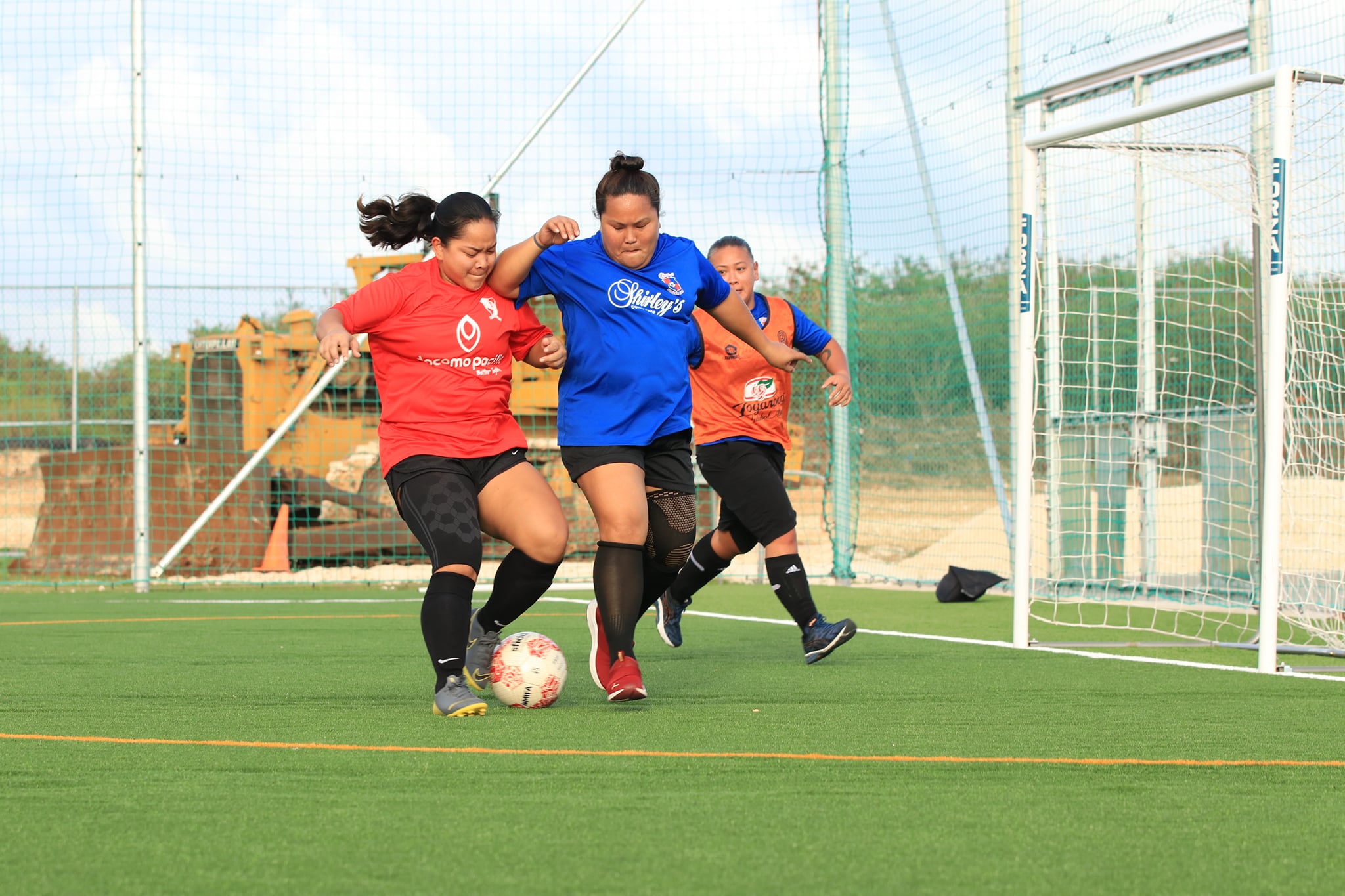 Shirley's and Paire players battle for the possession during a Spring 2022 Dove Women's League game Sunday at the NMI Soccer Training Center.