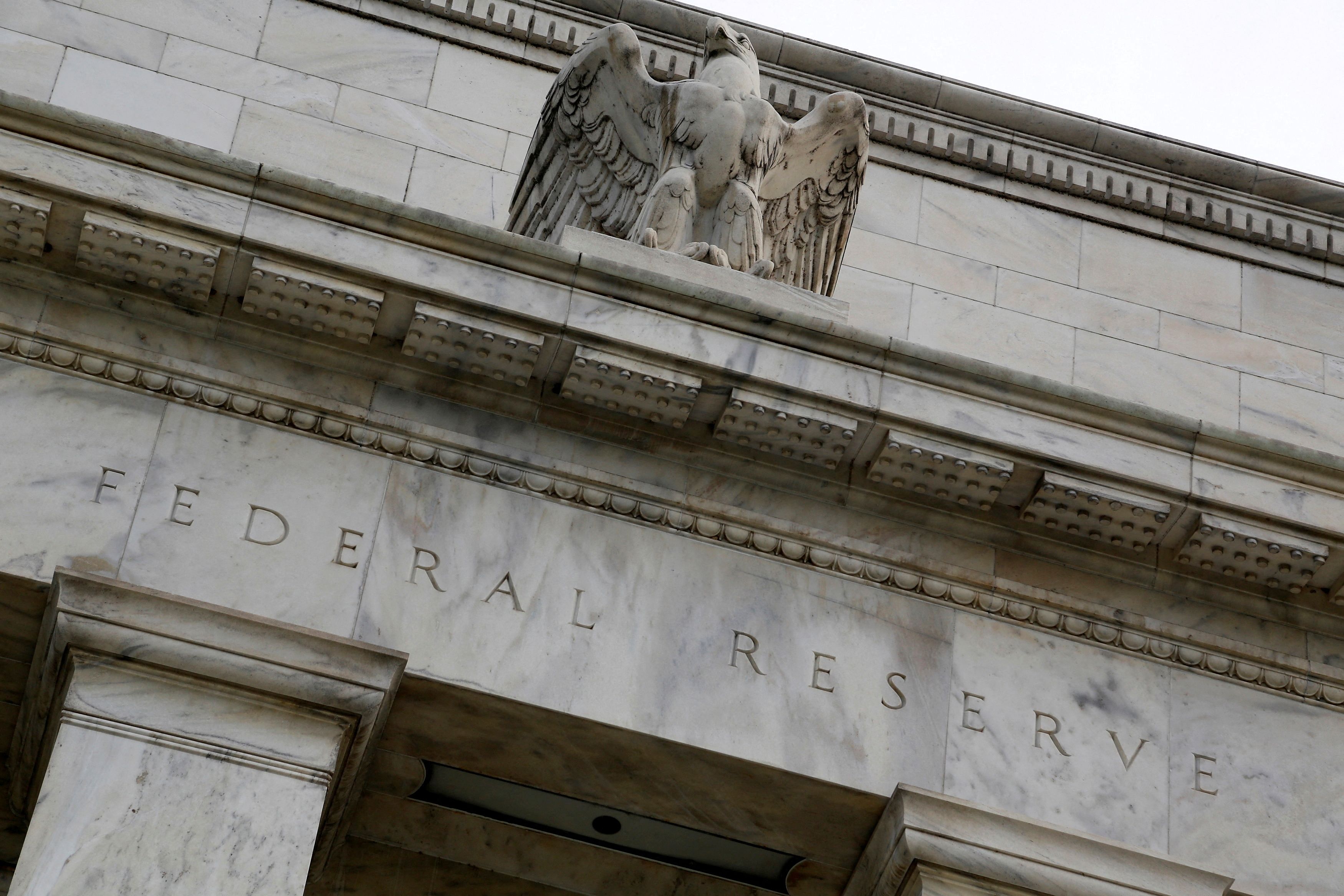 An eagle tops the Federal Reserve building's façade in Washington, July 31, 2013.