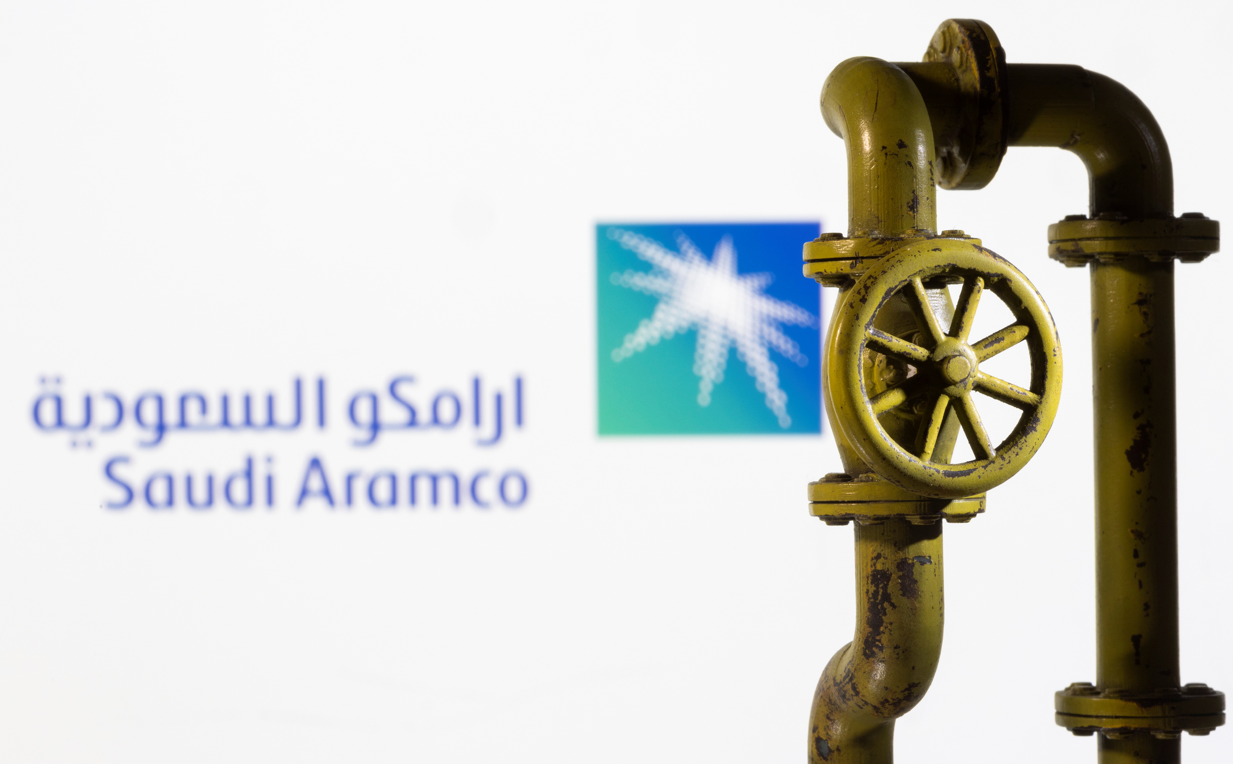 A 3D printed natural gas pipeline is placed in front of displayed Saudi Aramco logo in this illustration taken Feb. 8, 2022.