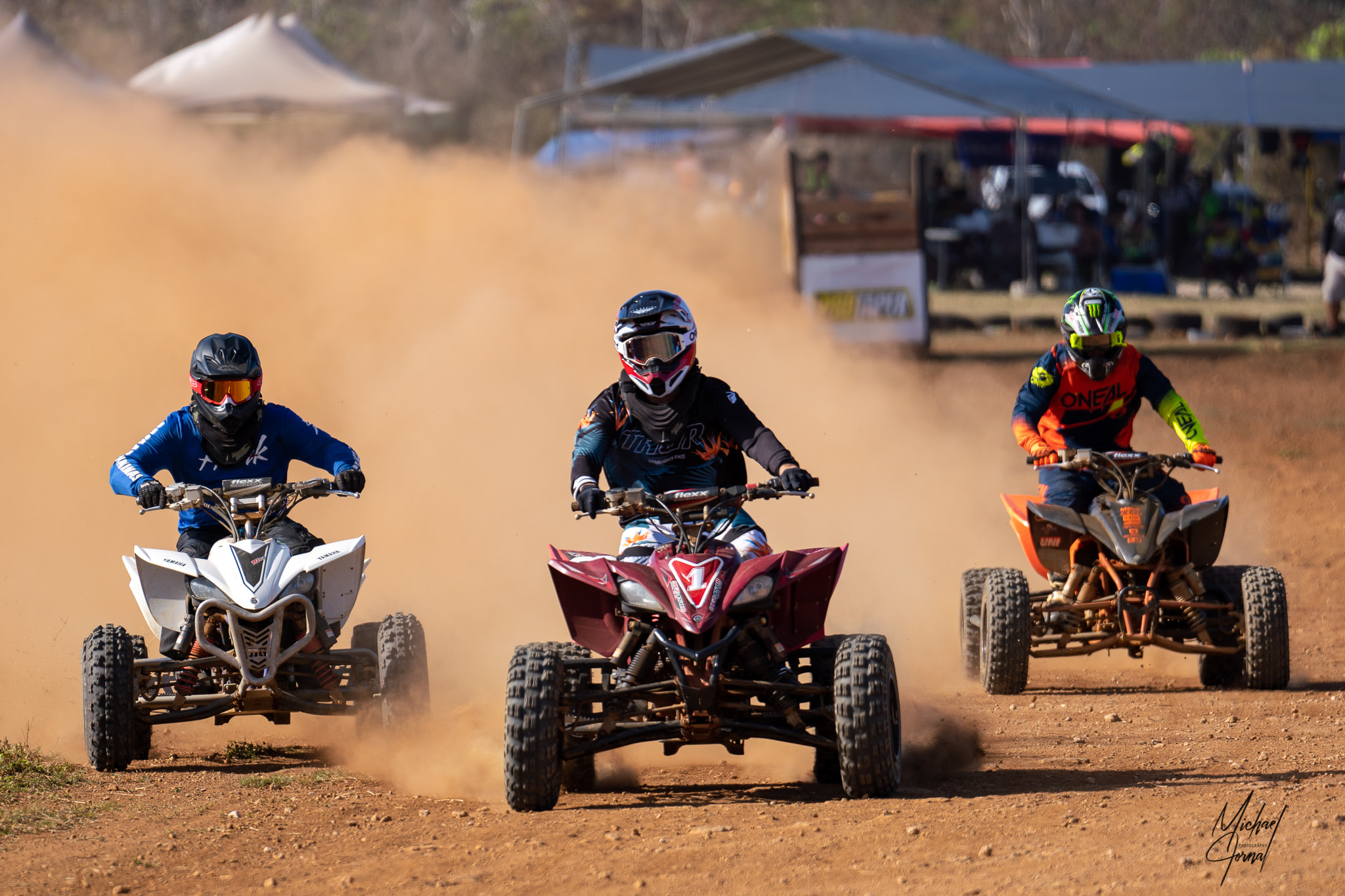 Christian Camacho, center, leads the Big Boy ATV class of the Marianas Racing Association Points Race Series at  Cowtown Raceway Park on Sunday.