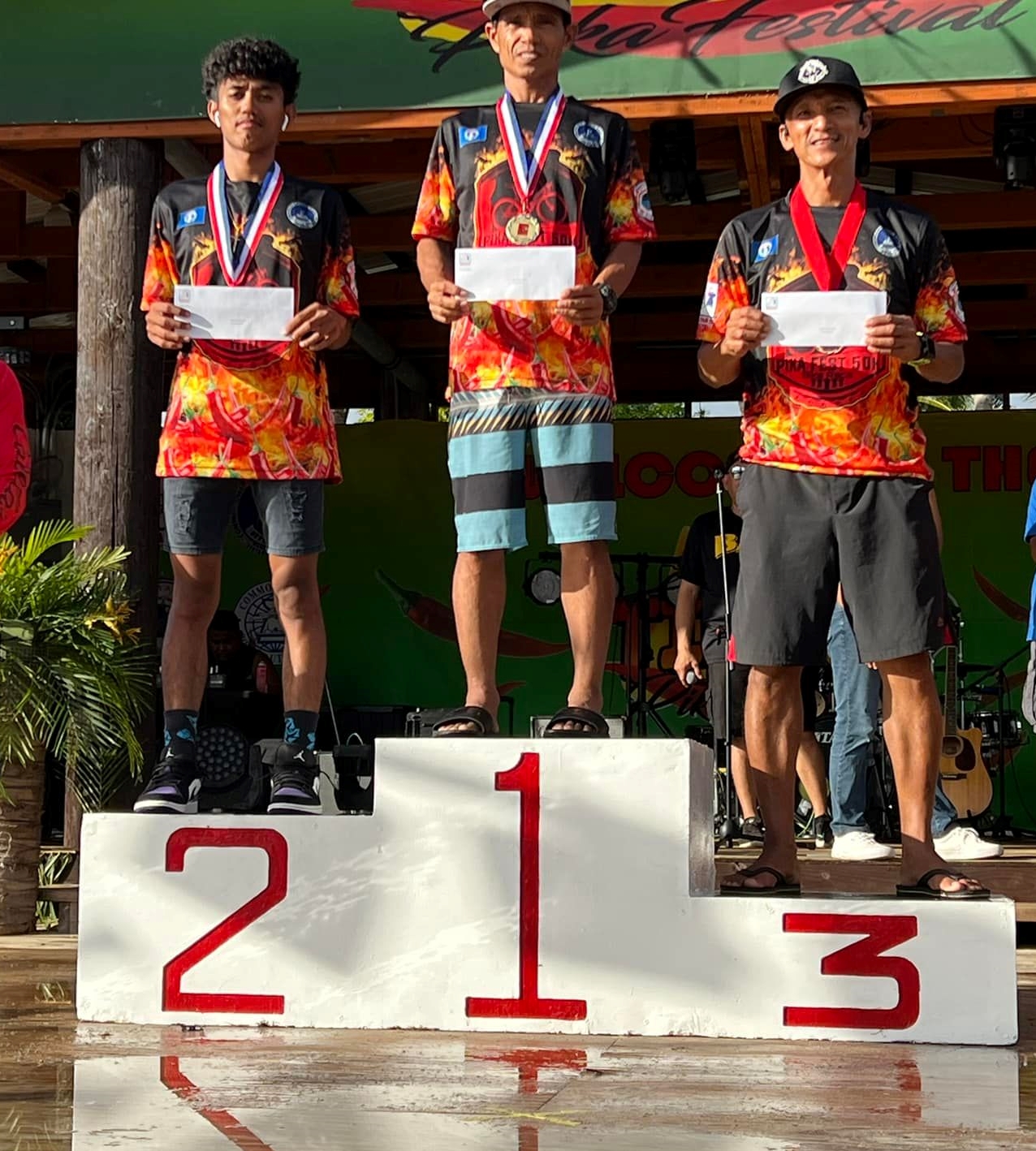 Joel Buco, center, won the gold in the men's open division of the 7th Annual Pika Bike Race on Tinian Saturday. Also in photo are the other medalists, Renren Gaviola and Mark Isip.