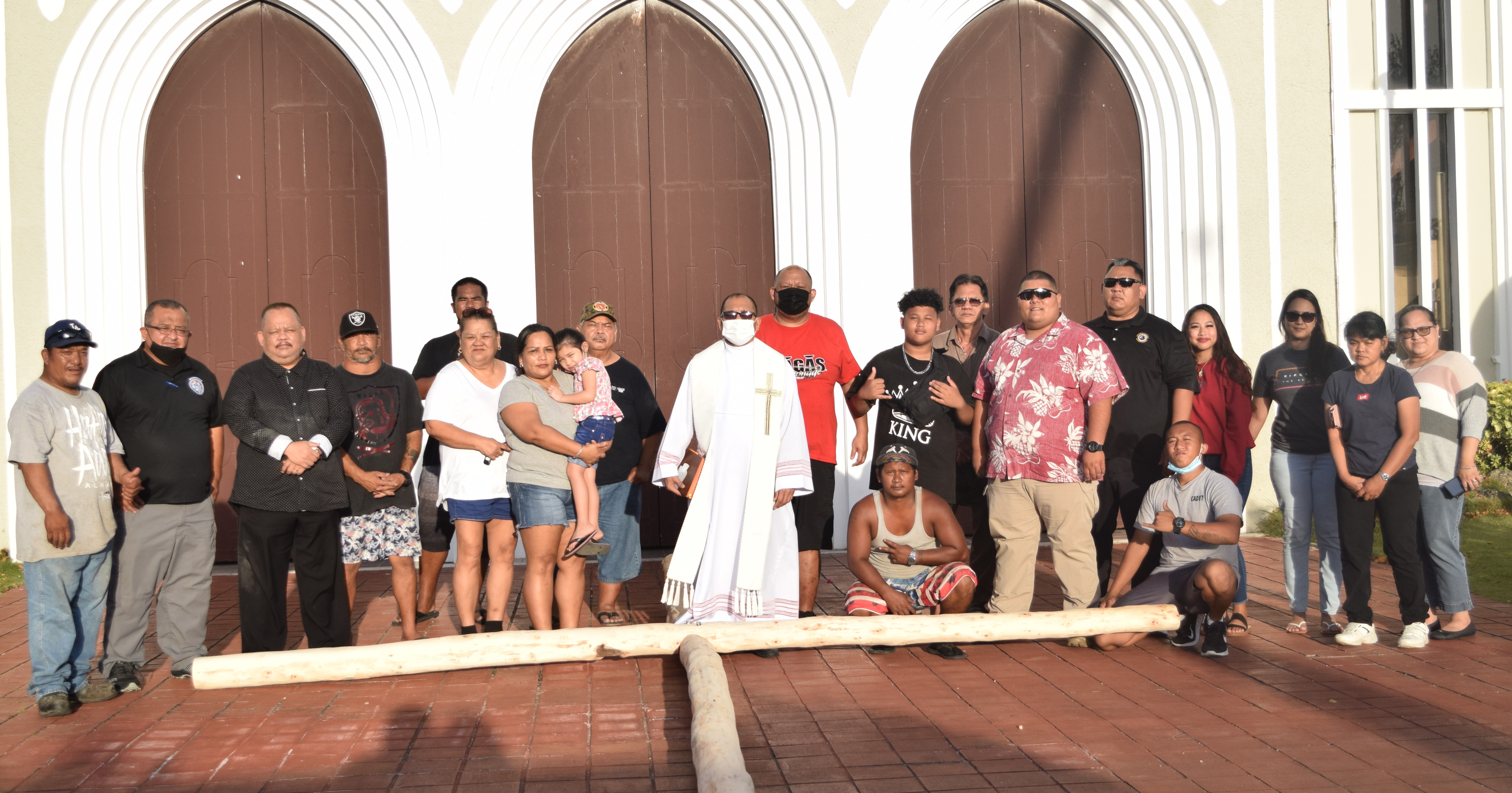 Rev. Fr. Rey D. Rosal center, is joined by  four generations of the Francisco "Tanko" Palacios clan at Mt. Carmel Cathedral. Also in the photo is the new cross that will be brought to the summit of Mt. Tapochao on Good Friday.