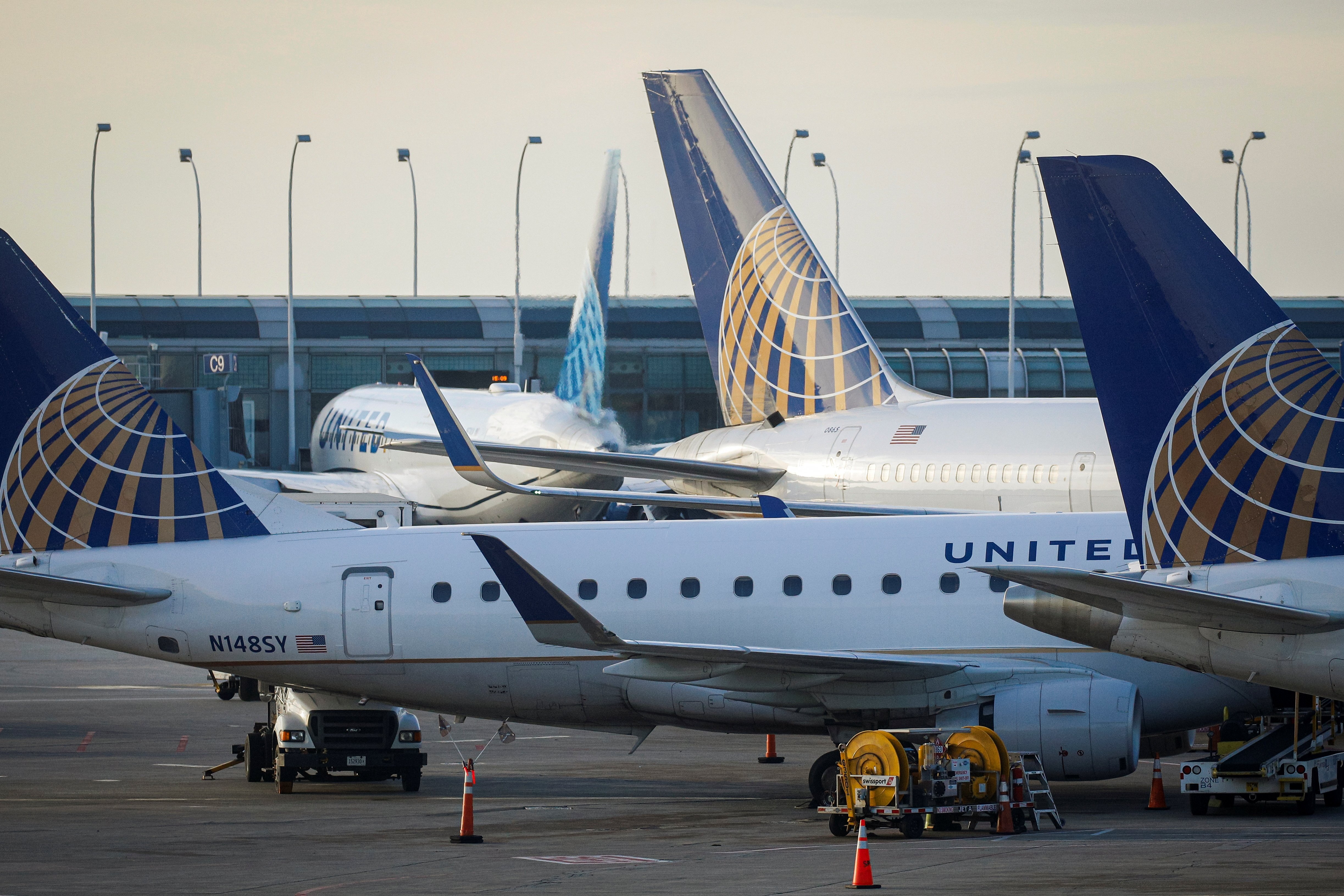 United Airlines planes are parked at their gates at O'Hare International Airport ahead of the Thanksgiving holiday in Chicago, Illinois,  Nov. 20, 2021.
