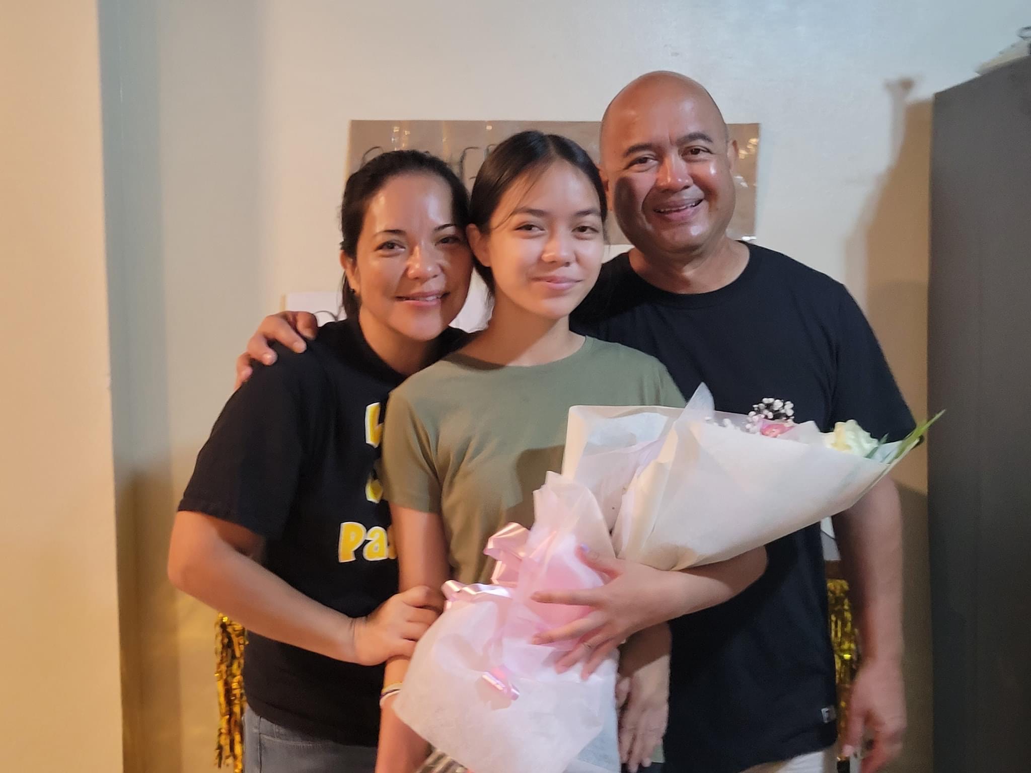 Ana Guadalupe Villagomez with her proud parents Jennifer and Richard.