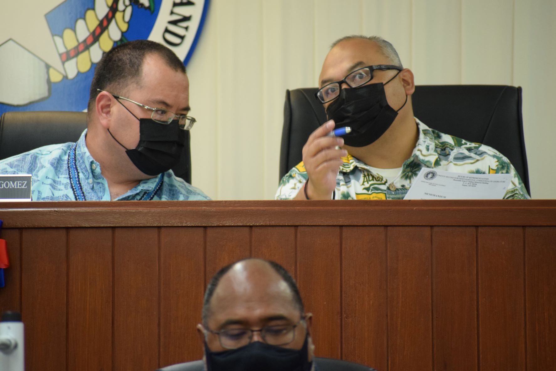 Speaker Edmund Villagomez and Vice Speaker Blas Jonathan Attao confer during the House session on Tuesday.