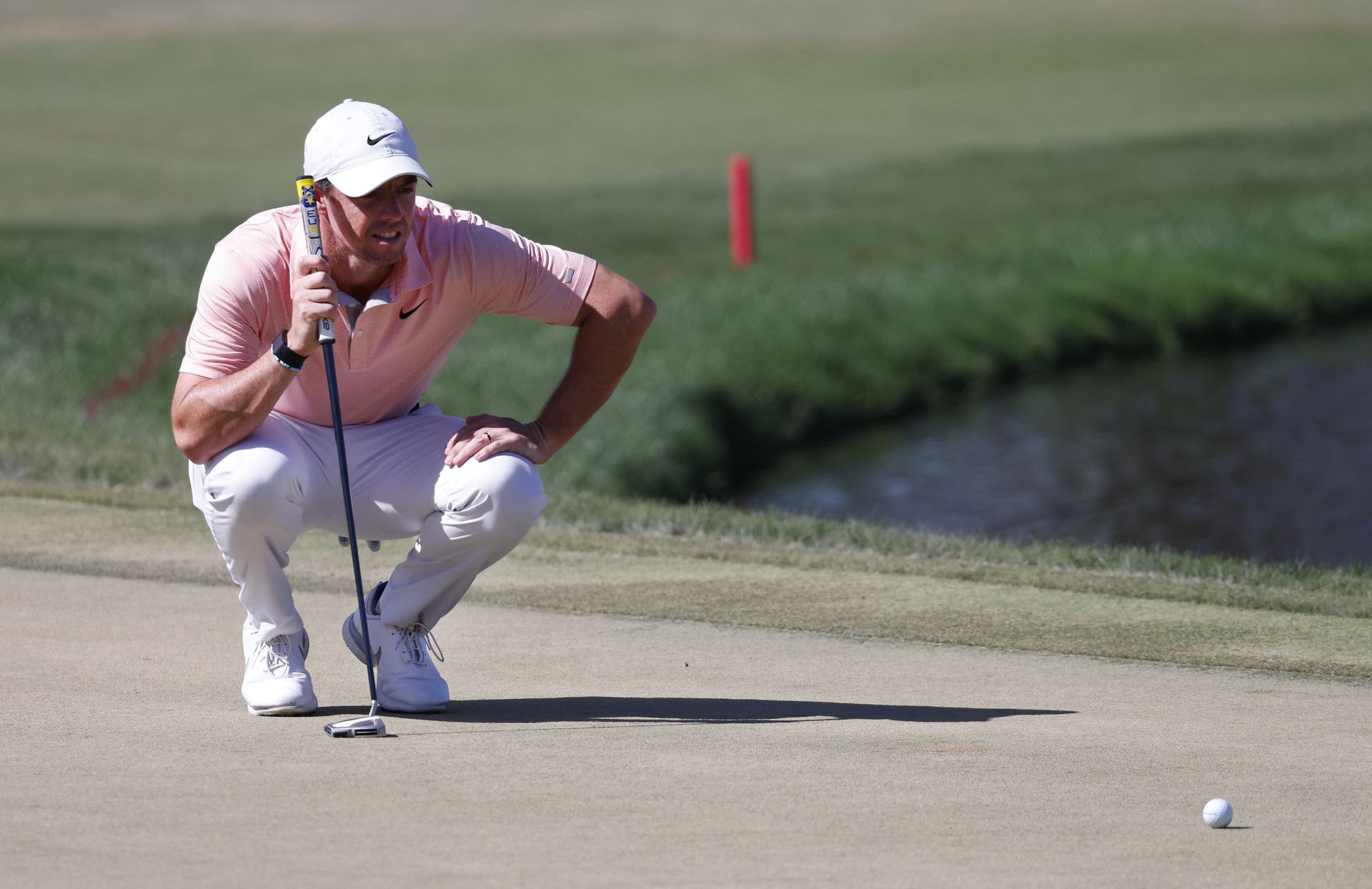 Rory McIlroy lines up his putt on the eighth hole during the final round of the Arnold Palmer Invitational golf tournament in Orlando, Florida, March 6, 2022.