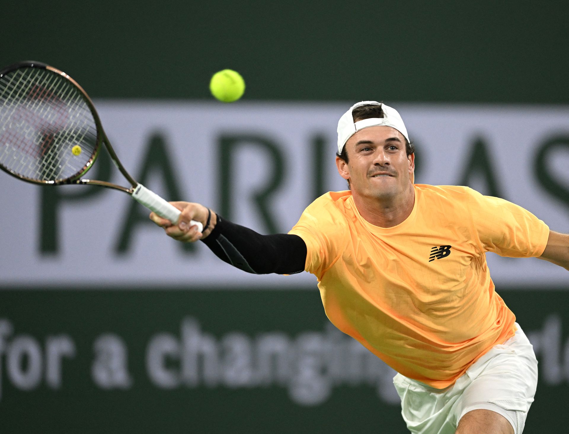 Tommy Paul plays a point in his second round match against Alexander Zverev  at the BNP Paribas Open at the Indian Wells Tennis Garden in Indian Wells, California.