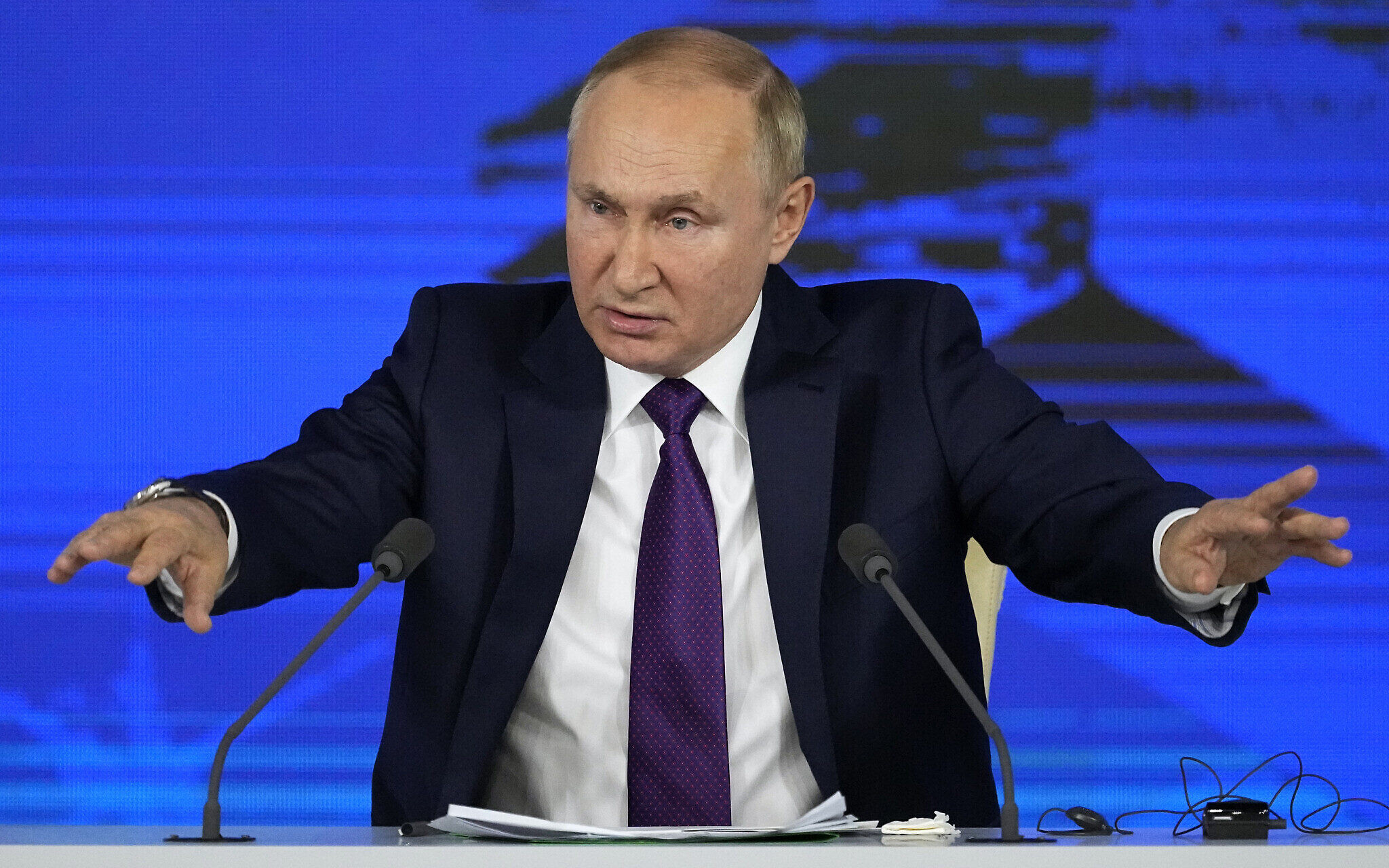 Russian President Vladimir Putin gestures while speaking during his annual news conference in Moscow, Russia, Dec. 23, 2021. 