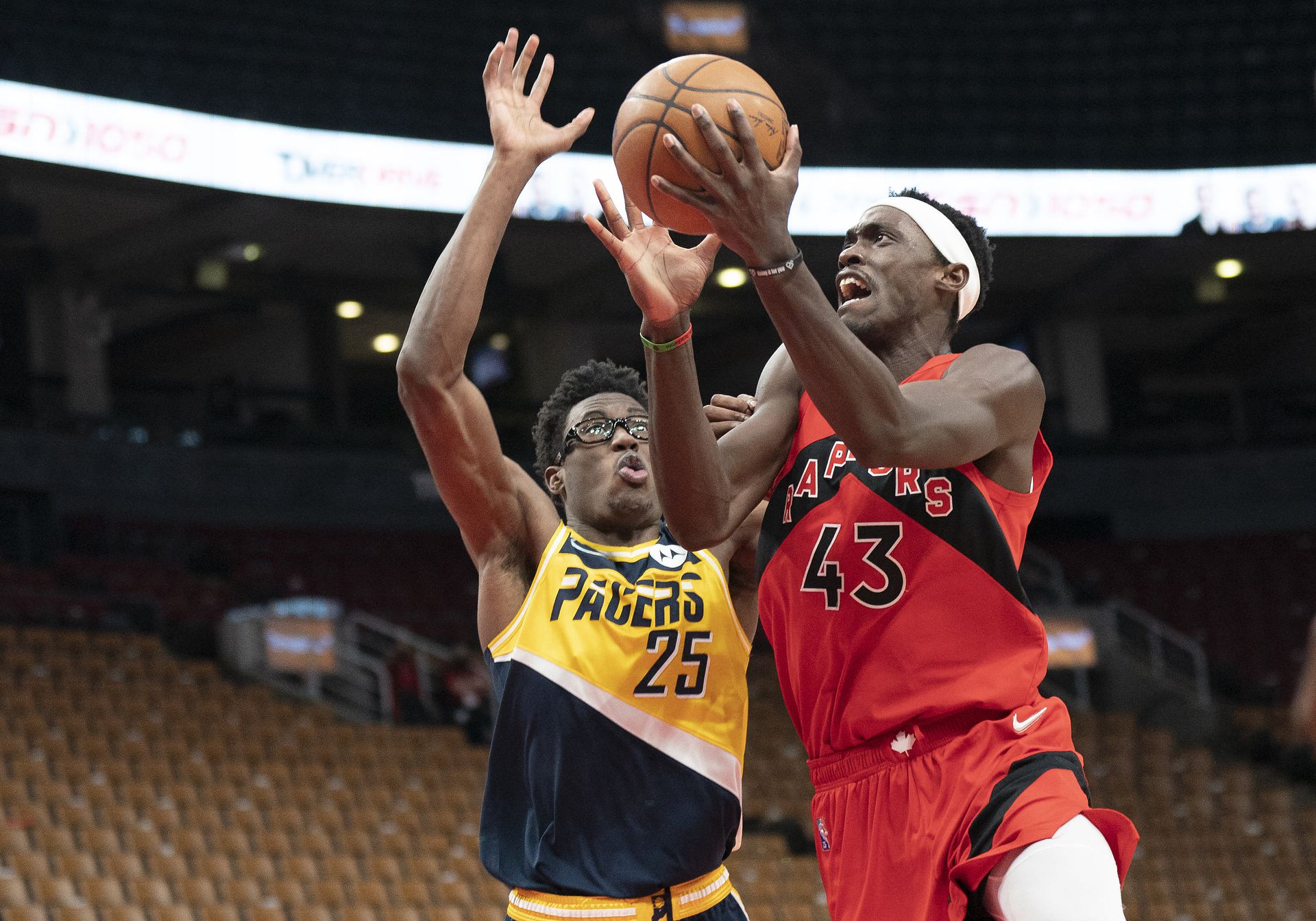 Toronto Raptors forward Pascal Siakam (43) drives to the basket against Indiana Pacers forward Jalen Smith (25) during the third quarter at Scotiabank Arena in Toronto, Ontario on March 26, 2022.