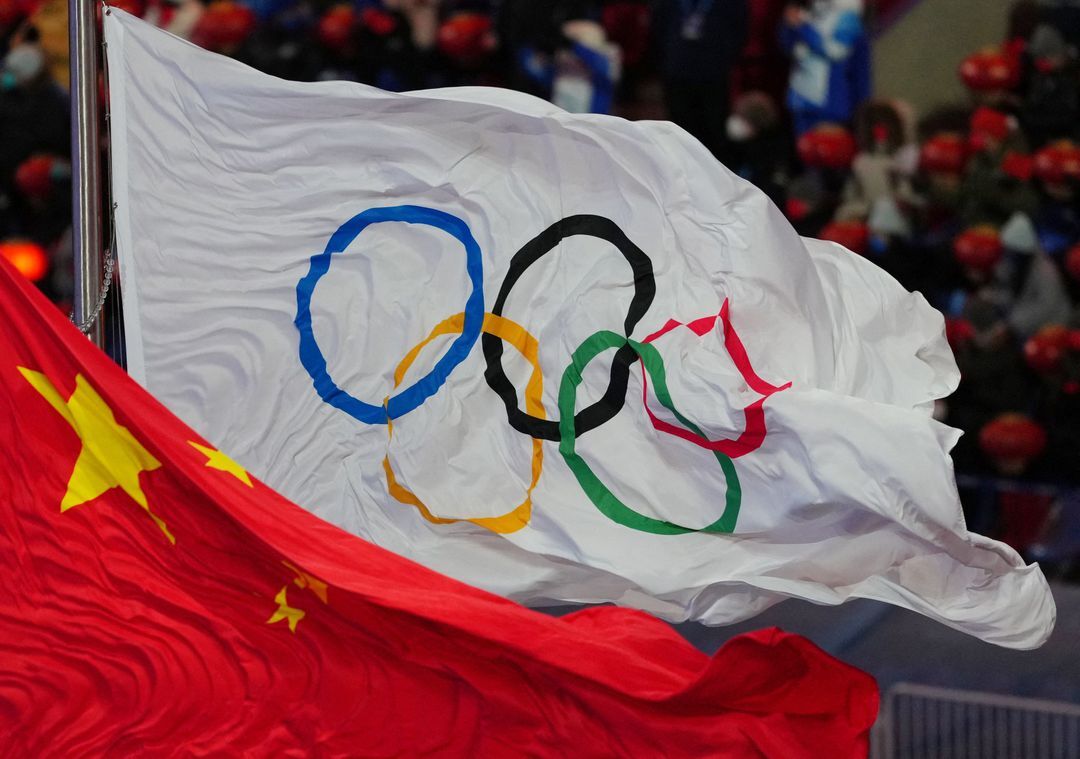 The national flag of China and the flag of the International Olympic Committee are pictured during the closing ceremony of the Beijing Winter Olympics at the National Stadium, Beijing, China on Feb. 20, 2022.