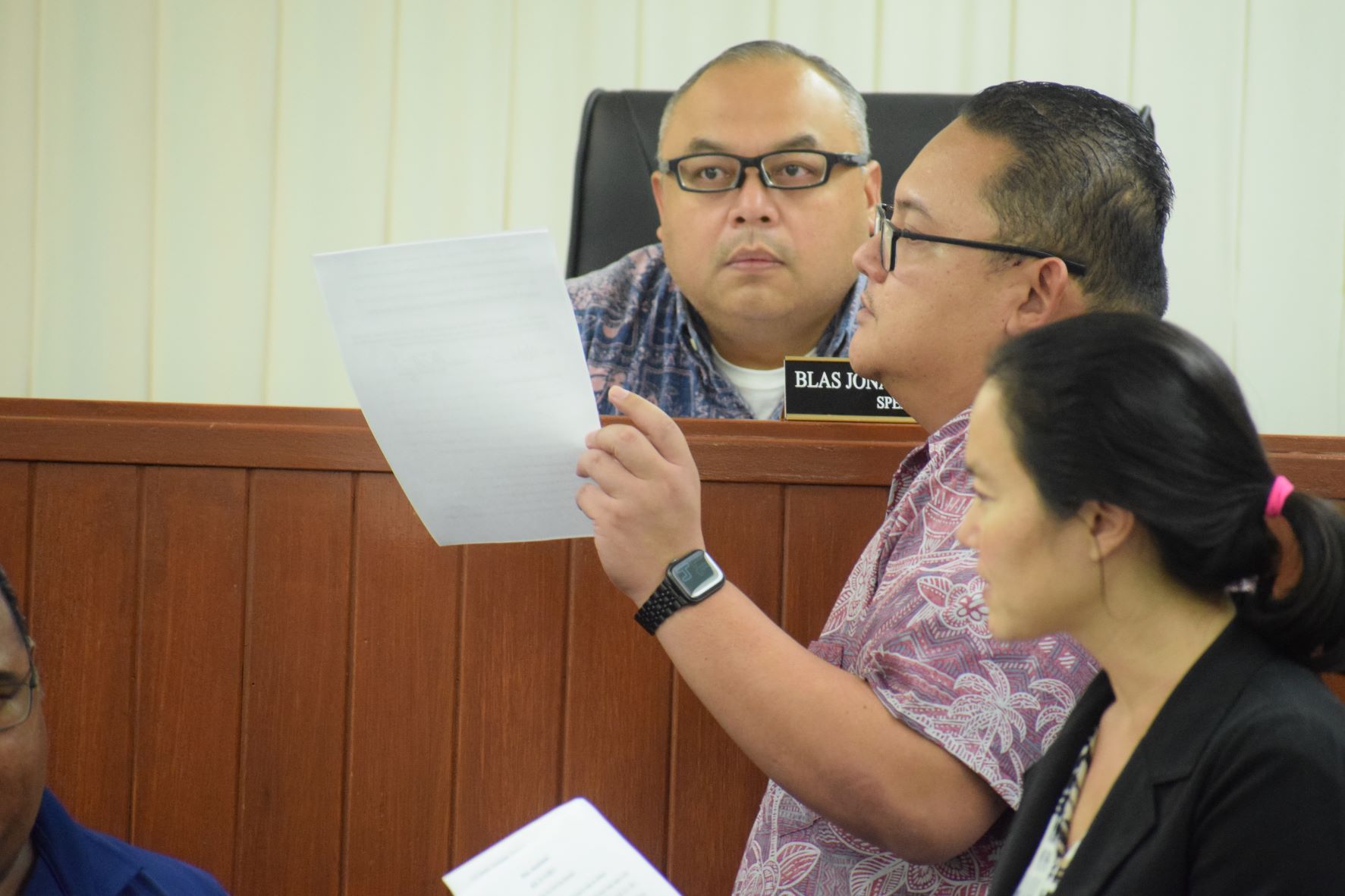 Vice Speaker Blas Jonathan Attao listens to Rep. Donald Manglona during a break from a House session last year. Also in photo is Rep. Tina Sablan.