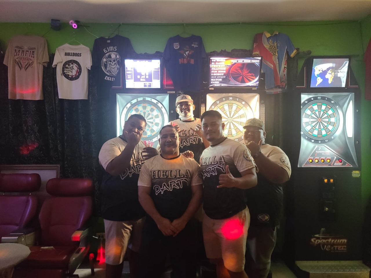 Team members of 6JMS Hella Darty pose for a photo after winning the B Division Bud Light Cup of the SEDA League at the 6JMS Sports Bar on Tuesday.