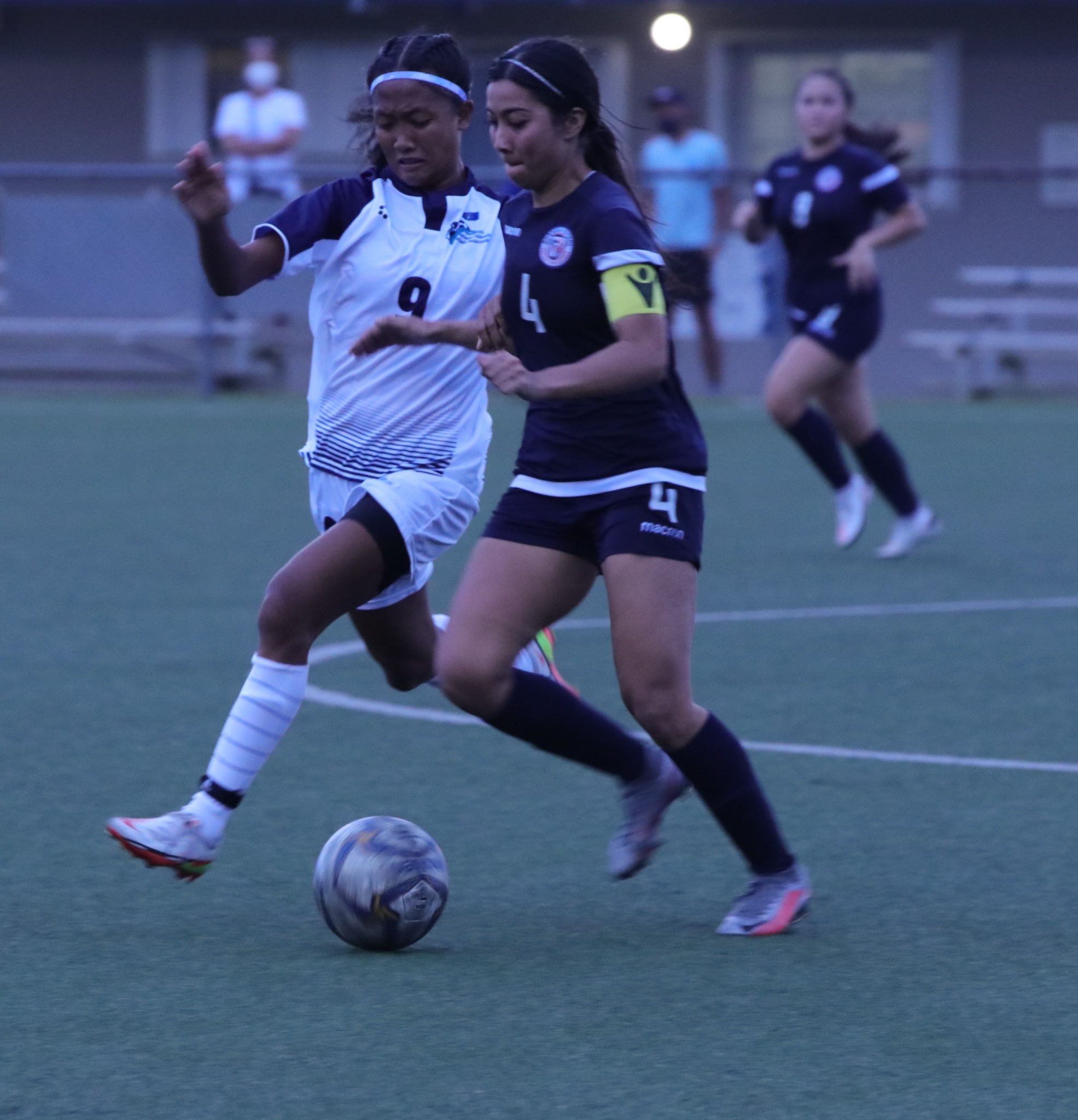 The NMI’s Kaithlynn Chavez, left, steps in to play defense on a Guam player during their friendly game last week at the Guam Football Association National Training Center.