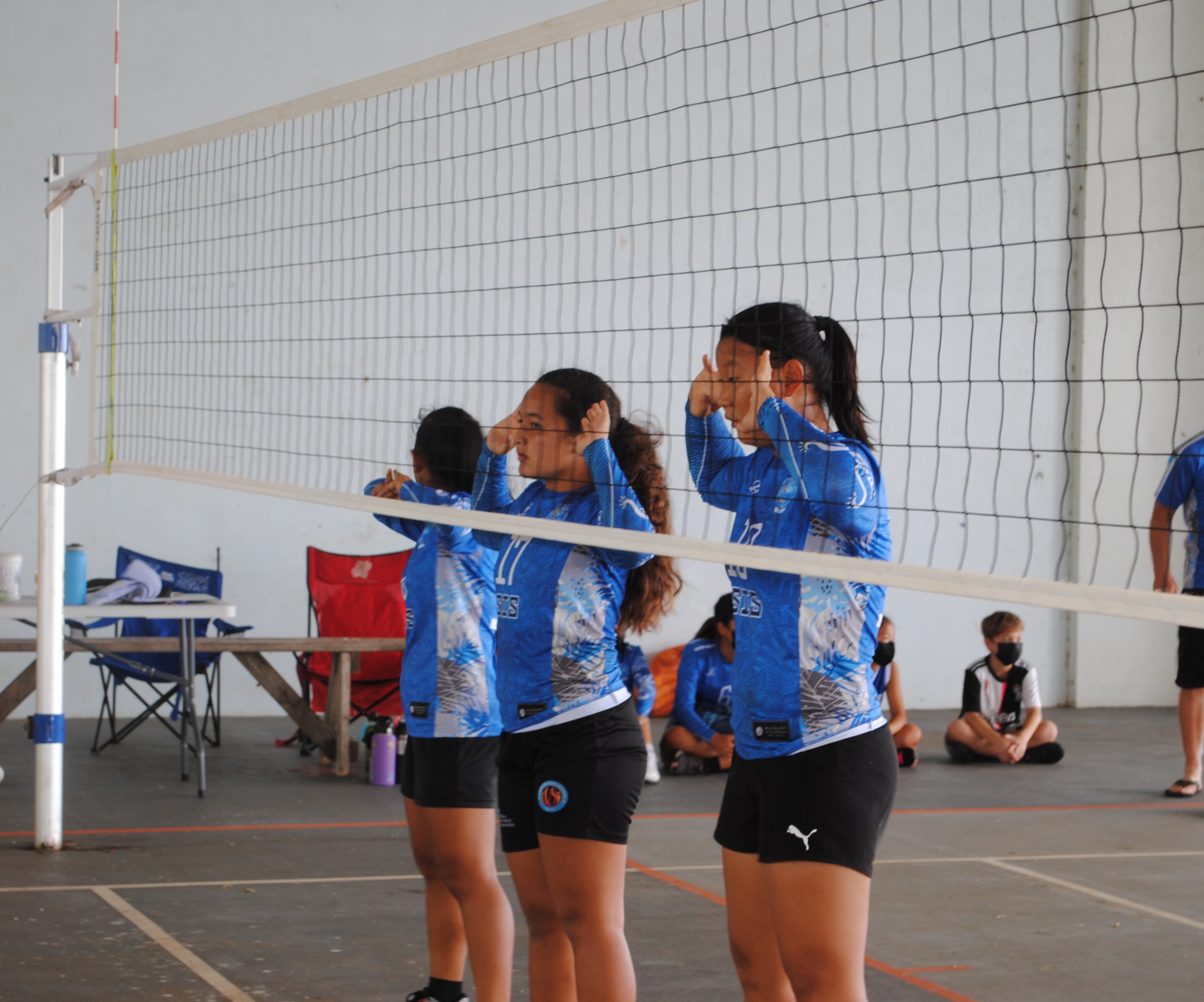 The SIS team gets ready for the incoming serve.