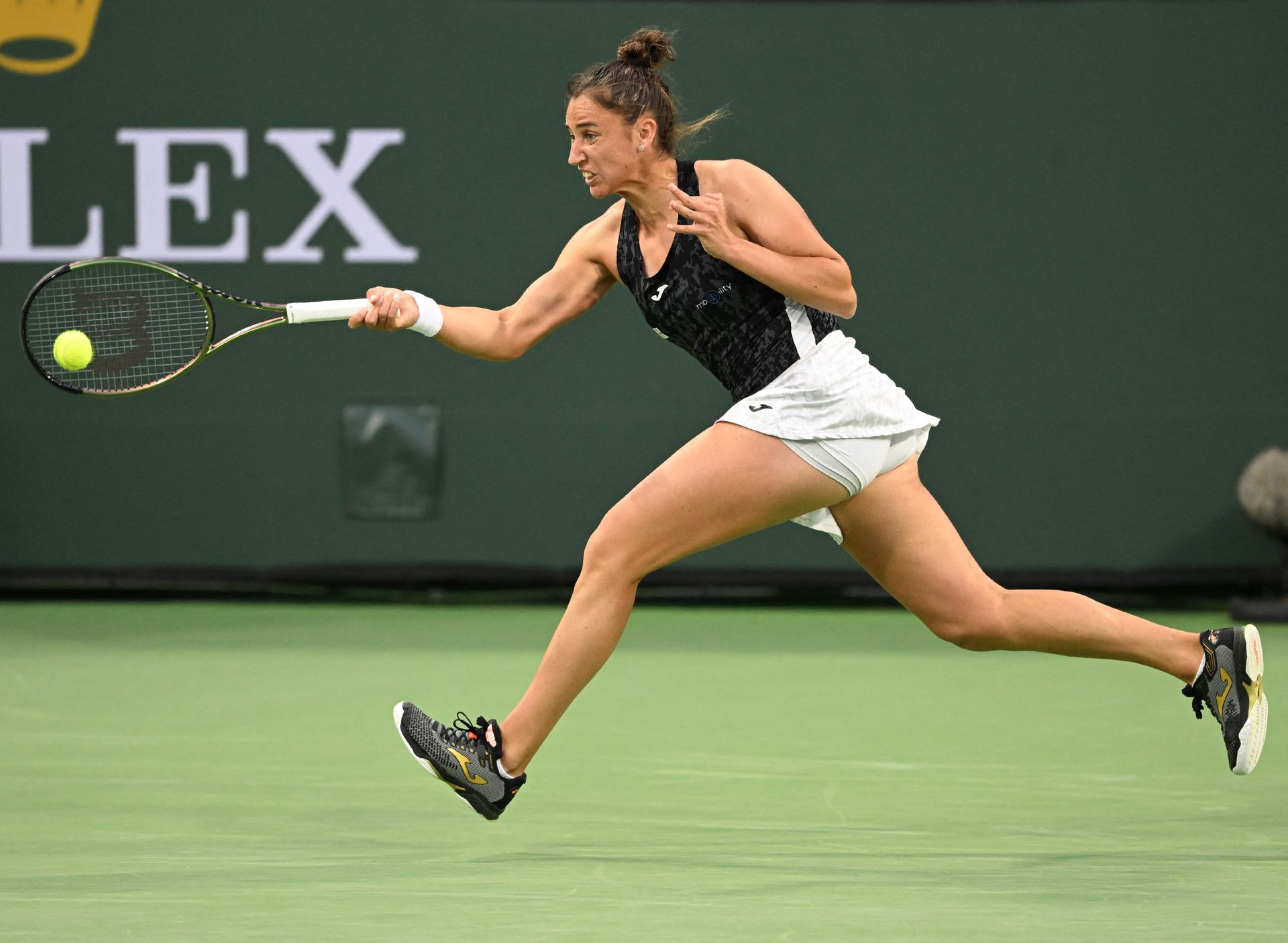 Sara Sorribes Tormo  hits a shot in her third round match against Paula Badosa  during the BNP Paribas Open at the Indian Wells Tennis Garden in Indian Wells, California on March 14, 2022.