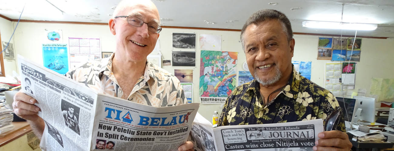Journal Editor Giff Johnson, left, with Tia Belau Publisher Moses Uludong in the Journal's newsroom in Majuro.