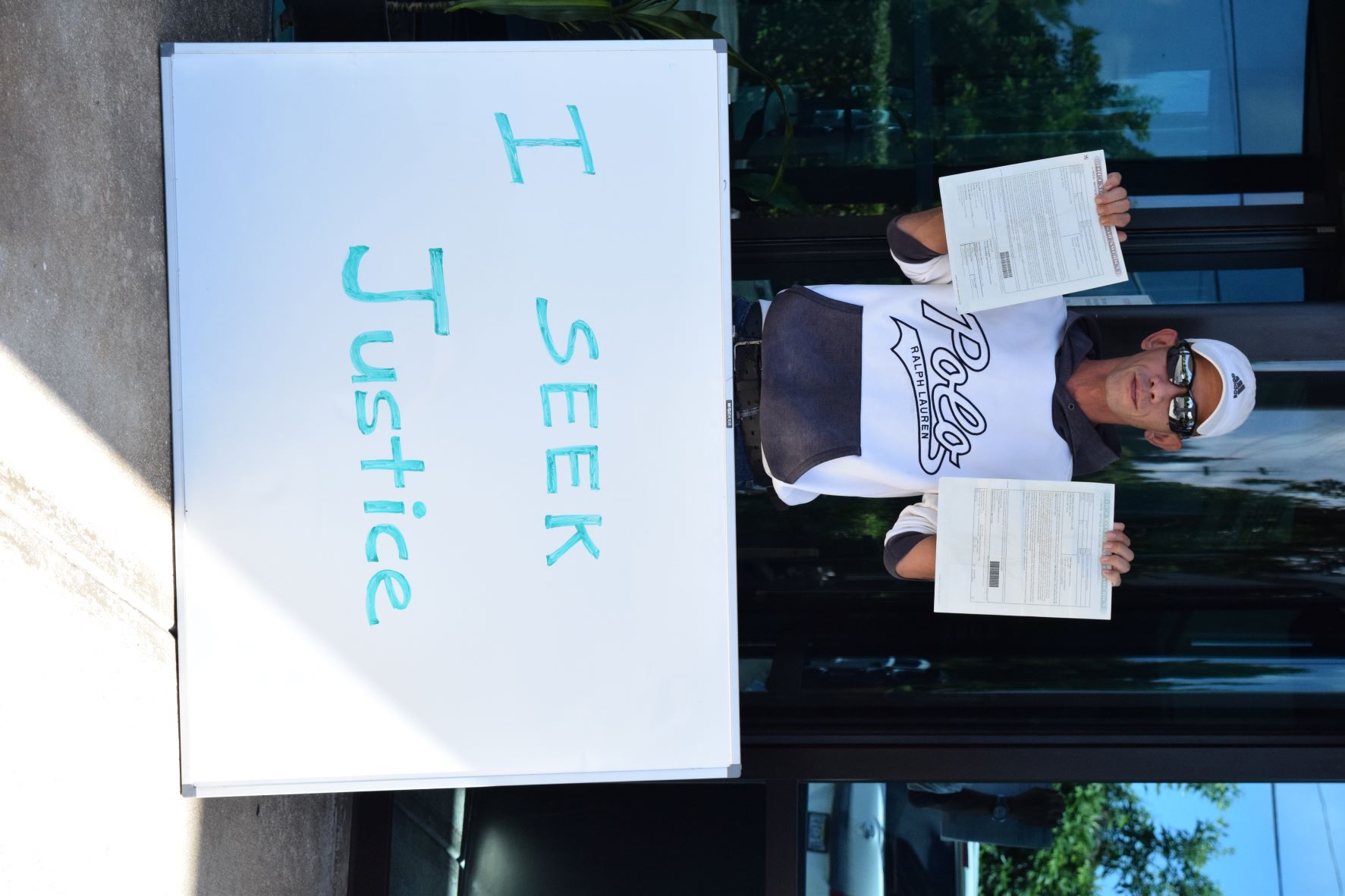 Chun Jee Wong stages a protest on Thanksgiving last year at the Marina Heights I Building which houses the office of the U.S. Department of Labor.
