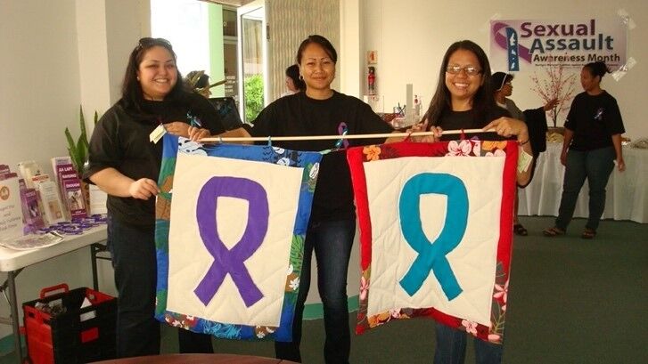 From left, long-time NMCADSV volunteer and board member Eulalia V. Arriola, Associate Director Kiki I. Benjamin, and Executive Director Maisie B. Tenorio pose for a photo before the 2010 Sexual Assault Awareness Month Proclamation Signing Ceremony