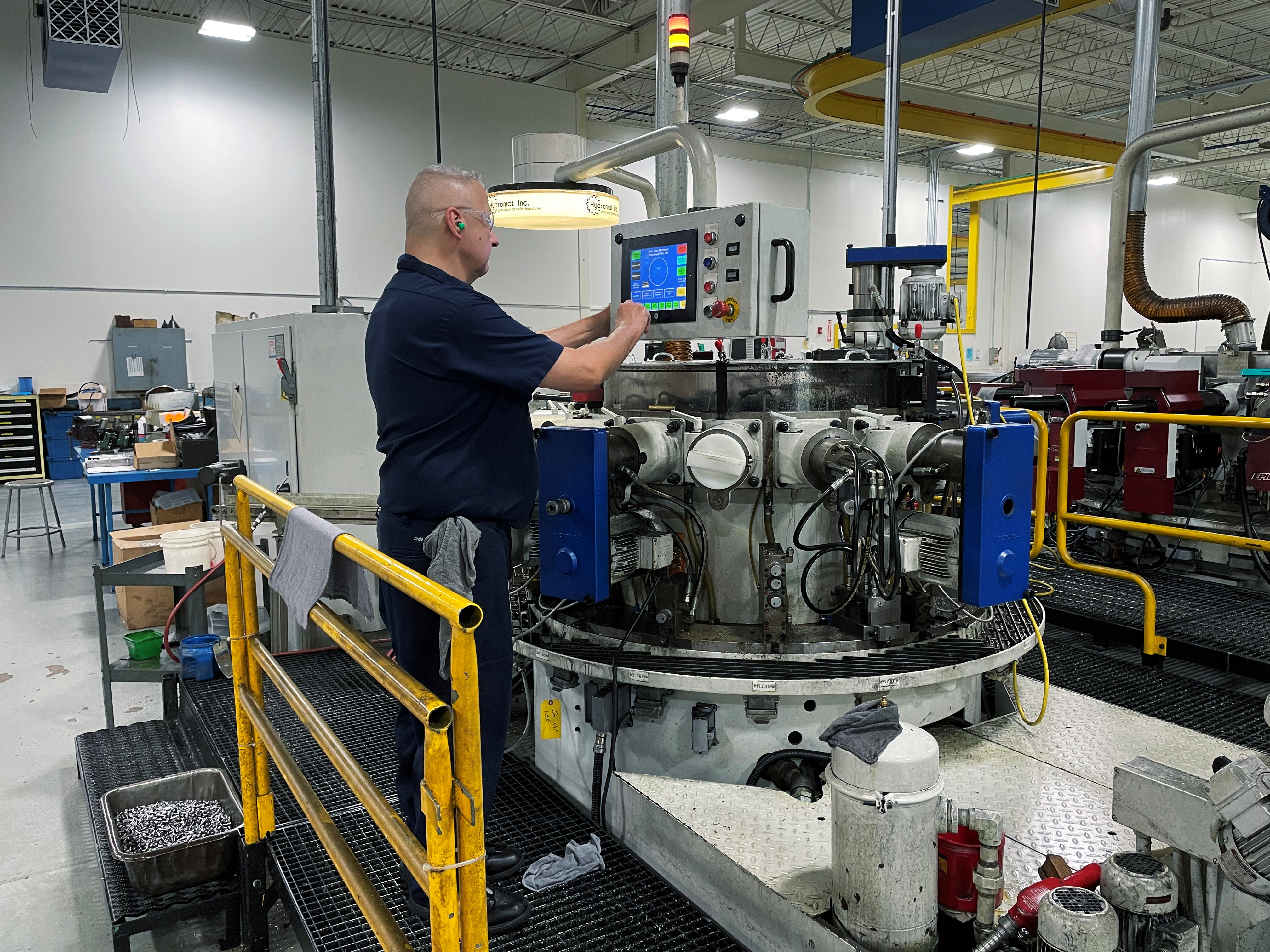 A worker operates one of the metal cutting machines at Gent Machine Co.'s factory in Cleveland, Ohio on May 26, 2021.