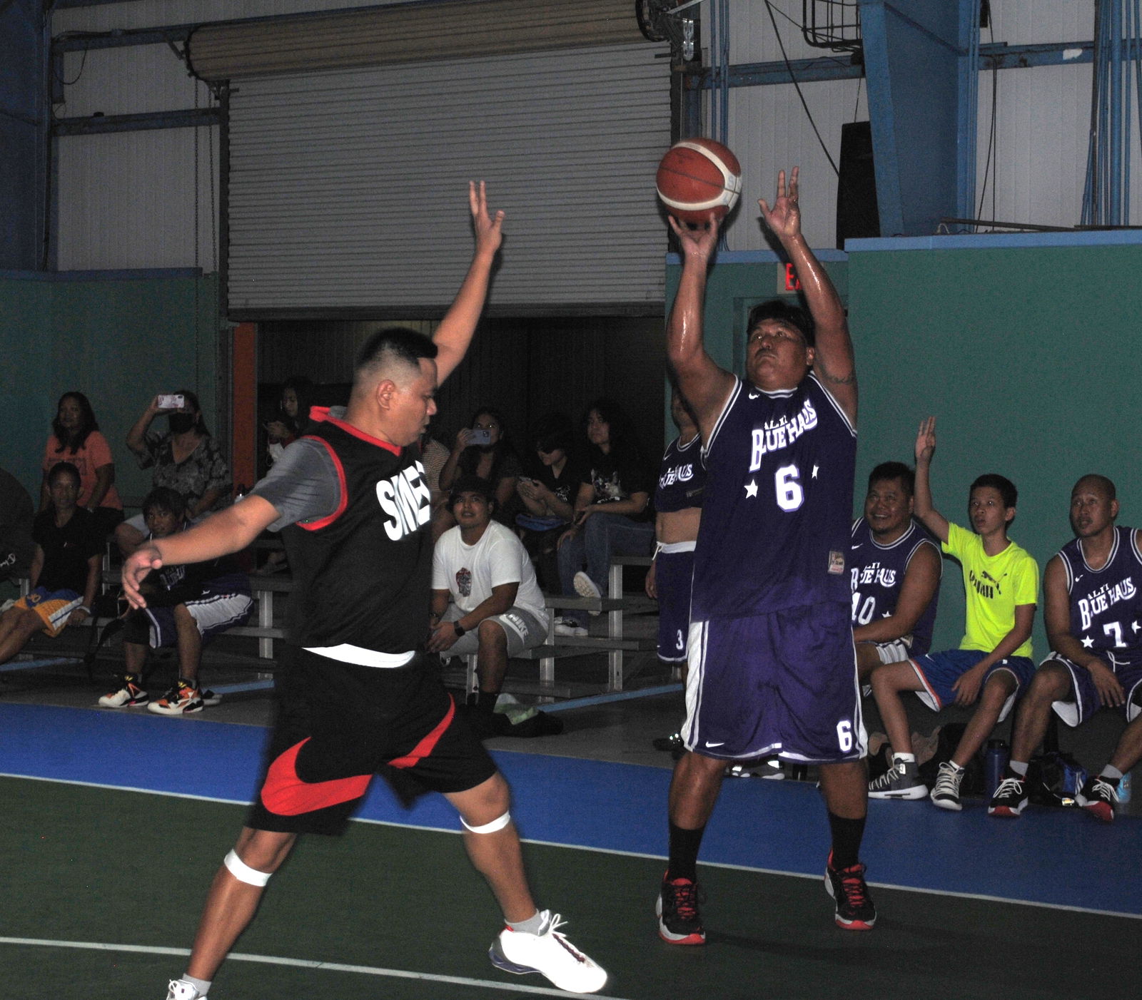 Bluehaus' John Santos pulls up for a contested three-point shot during a masters division game of the Saipan Centennial Lions Club Basketball League Saturday at the TSL Sports Complex.