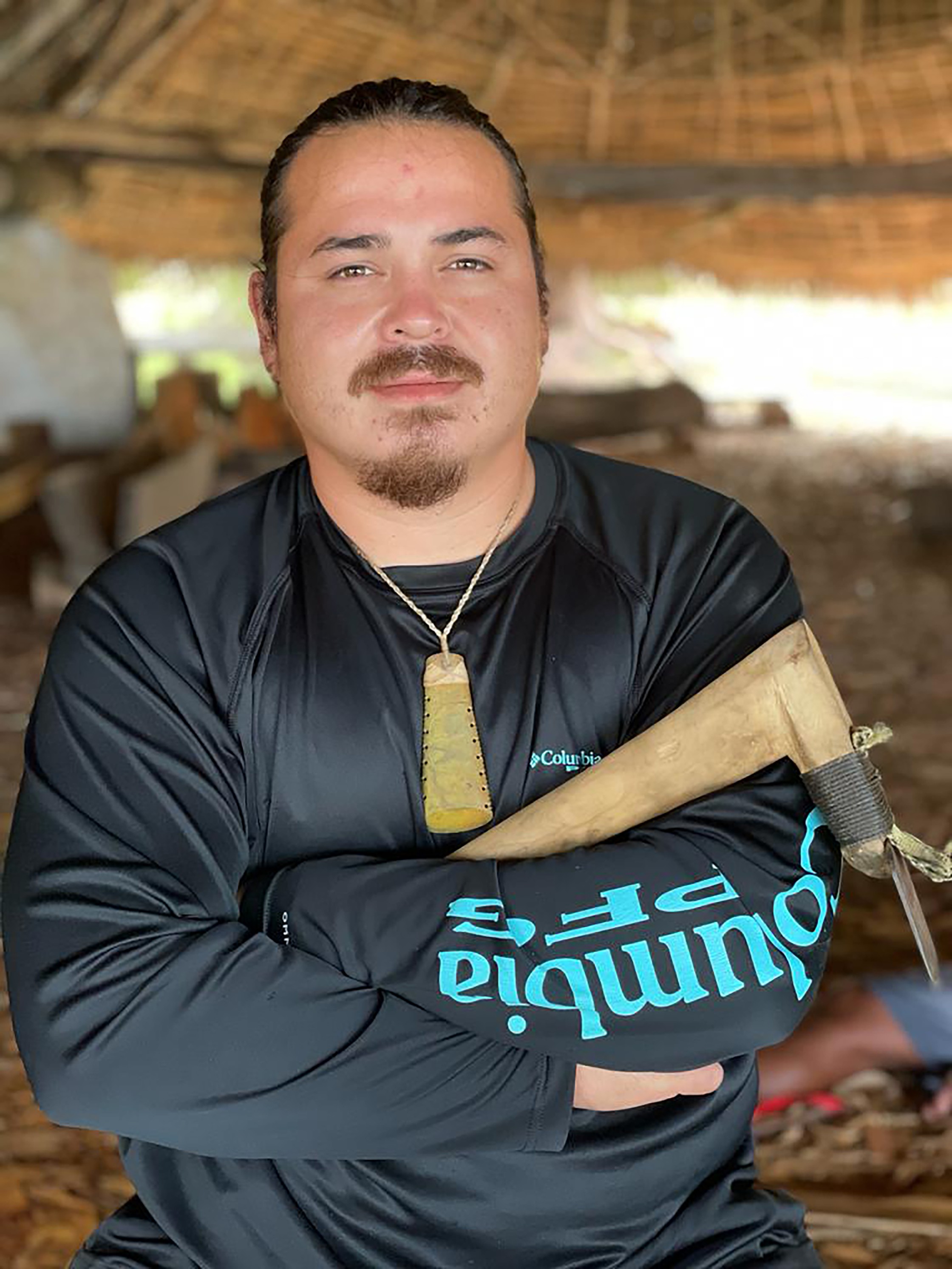 University of Guam senior anthropology major Tyler Warwick holds a traditional canoe carving tool inside a canoe house he helped build as a volunteer trades helper of the Seafaring Traditions Program in Saipan. Warwick was one of 20 applicants selected for the University of Hawaiʻi at Mānoa’s inaugural museum institute for indigenous Pacific Islanders.